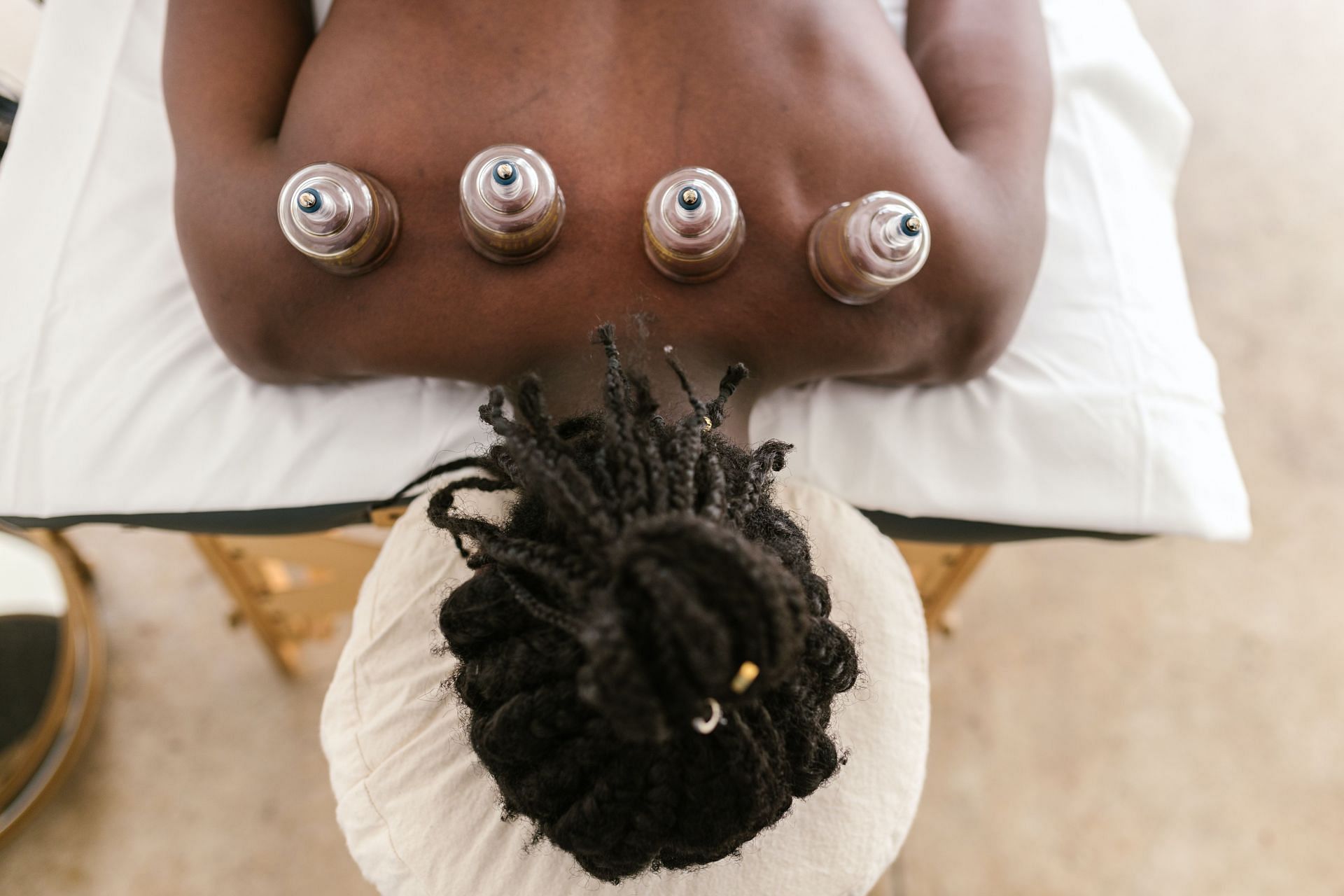 Cupping therapy improves blood circulation. (Image via Pexels/ Rodnae Productions)