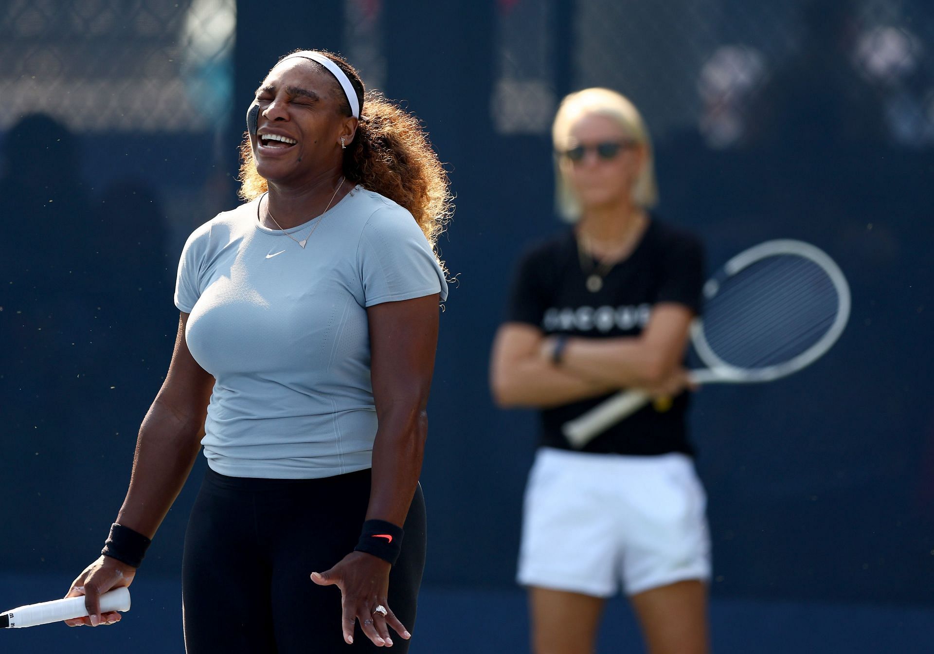 Serena Williams and Rennae Stubbs (in the background) at the 2022 US Open Previews