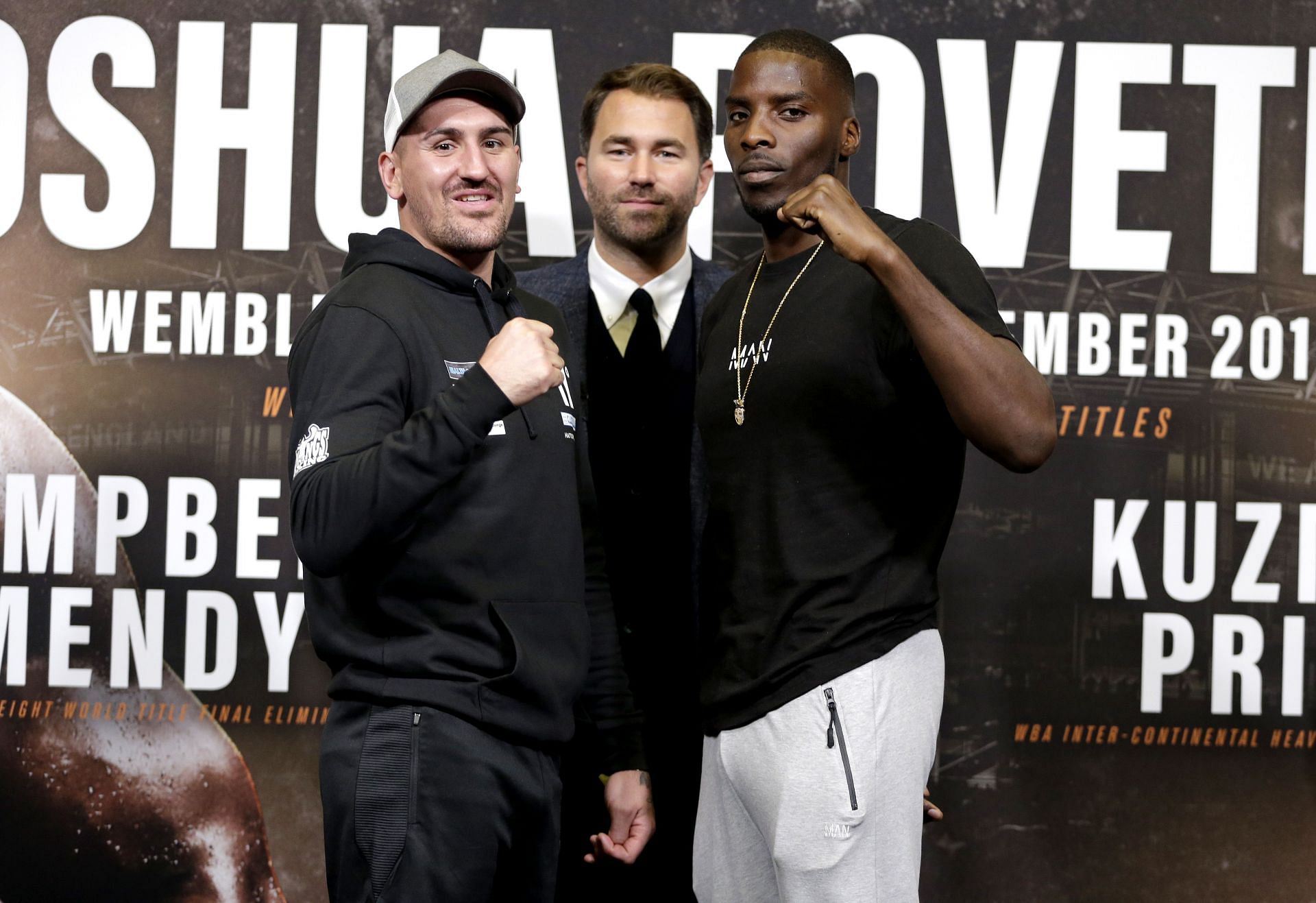 Eddie Hearn (center) and Lawrence Okolie (right) at Anthony Joshua vs. Alexander Povetkin Press Conference