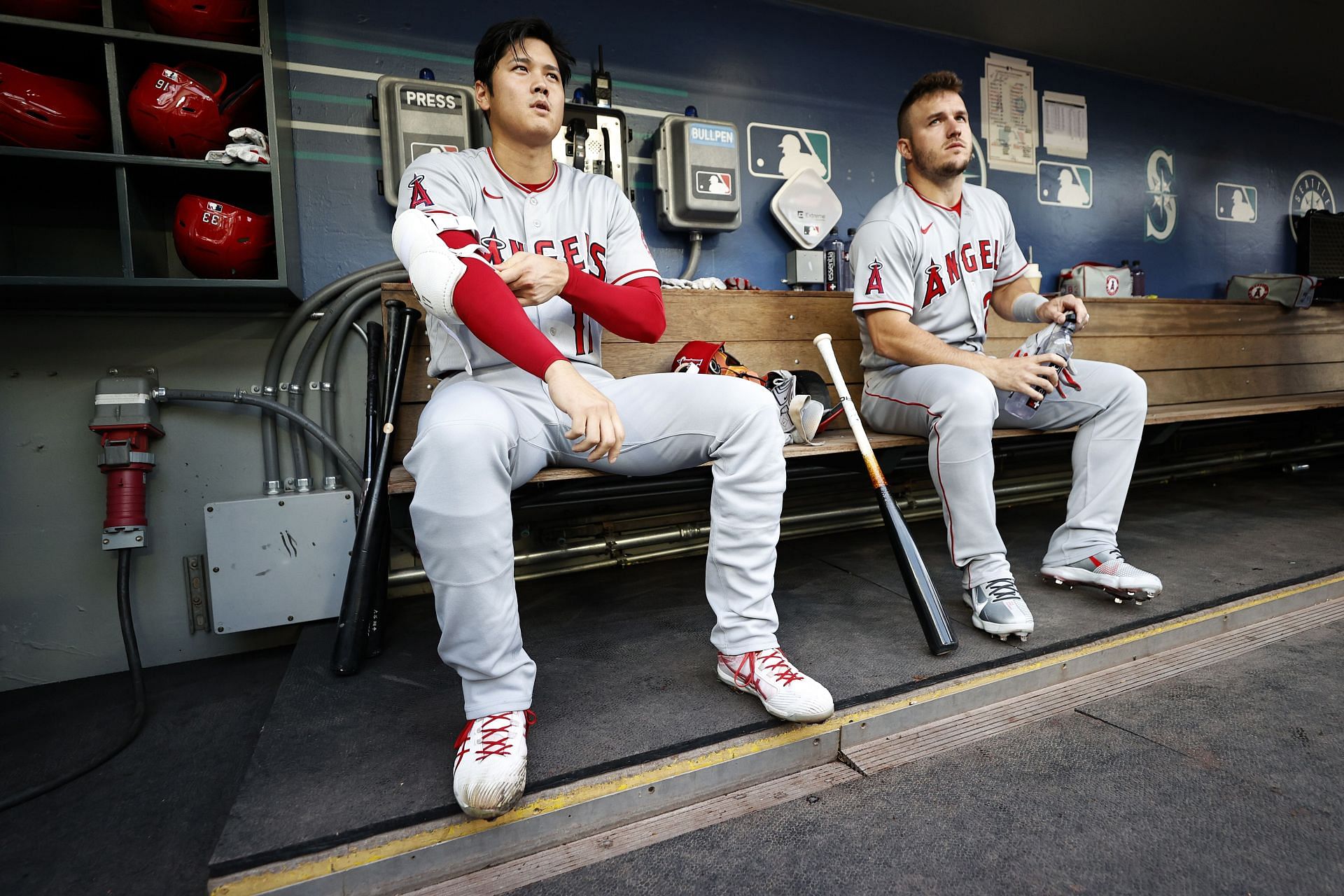 Shohei Ohtani #and Mike Trout of the Los Angeles Angels look on against the Seattle Mariners