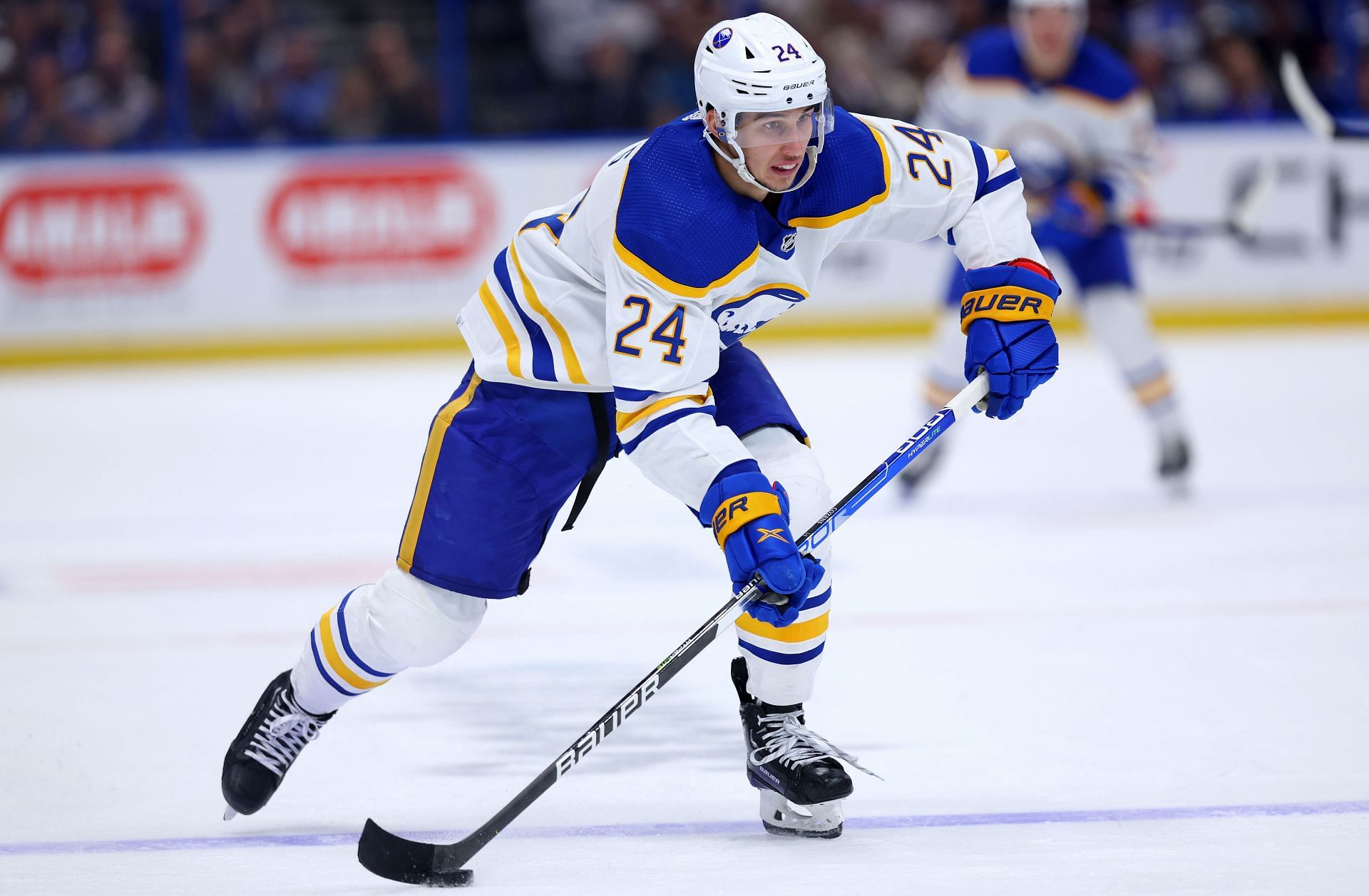 Dylan Cozens Buffalo Sabres Autographed 16 x 20 Blue Jersey Skating with Puck Photograph