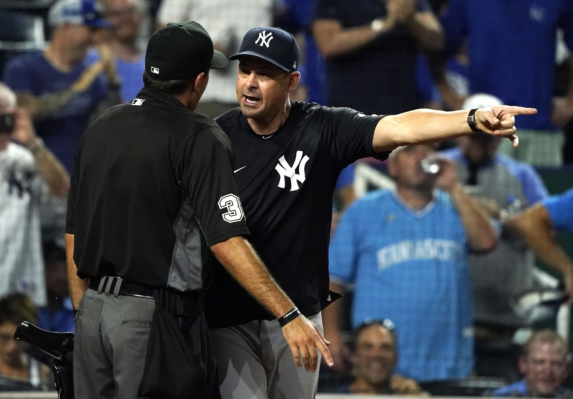 Aaron Boone argues with umpire Pat Hoberg after being ejected against the Kansas City Royals at Kauffman Stadium