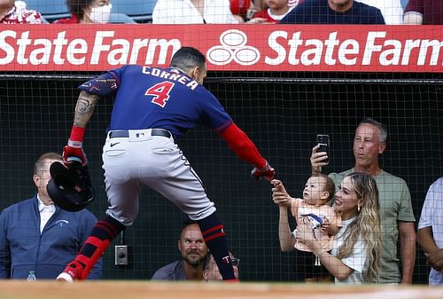 Minnesota Twins v Los Angeles Angels: ANAHEIM, CALIFORNIA - AUGUST 13: Carlos Correa #4 of the Minnesota Twins celebrates a home run with his wife Daniella Rodriguez and son, Kylo in the first inning against the Los Angeles Angels at Angel Stadium of Anaheim on August 13, 2022 in Anaheim, California. (Photo by Ronald Martinez/Getty Images)