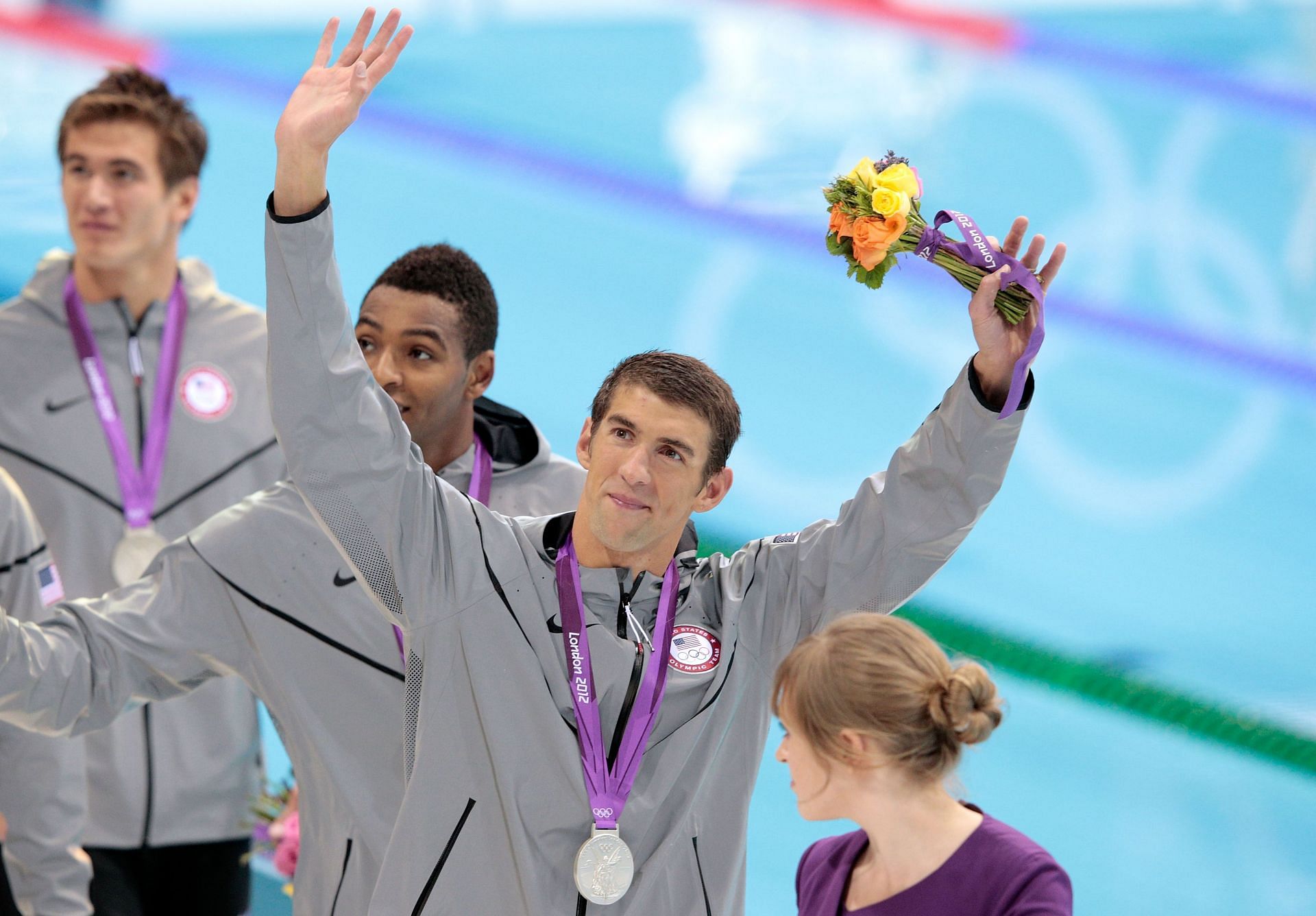 Michael Phelps of the United States celebrates with the silver medal won during the Men&#039;s 4 x 100m Freestyle Relay final of the London 2012 Olympic Games