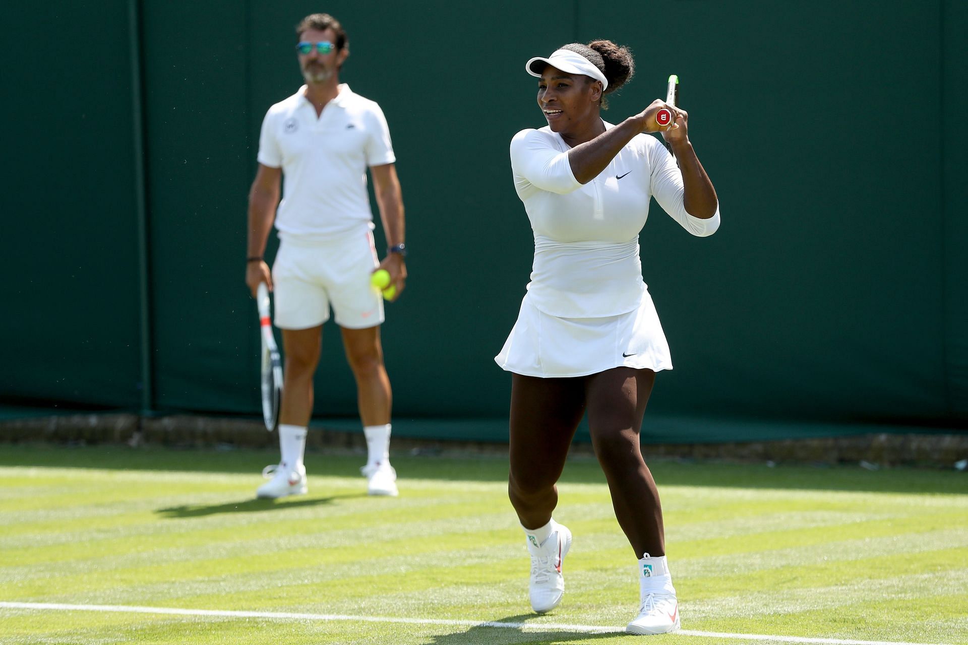 Patrick Mouratoglou (L) and Serena Williams