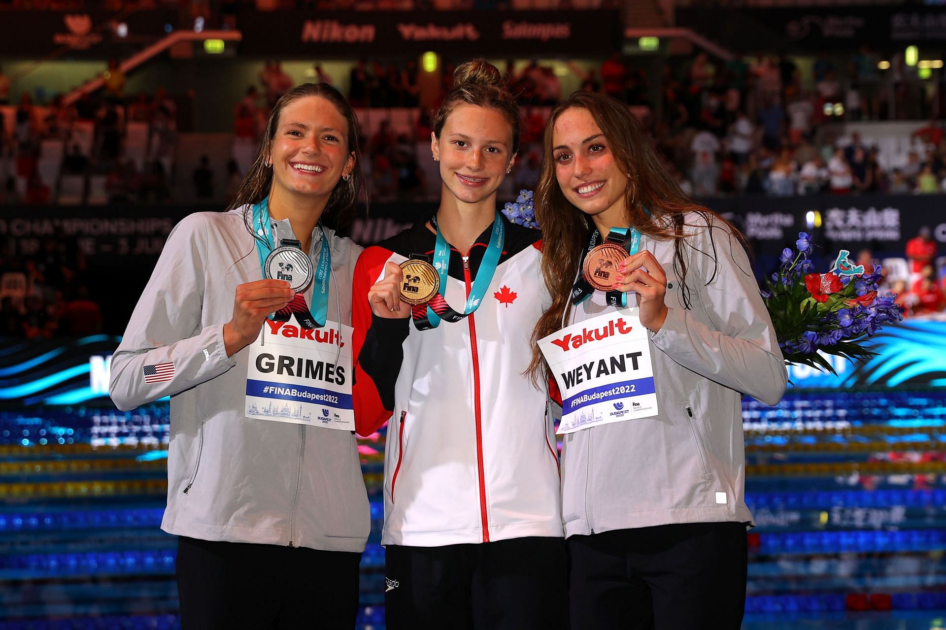 (L-R) Silver medalist, Katie Grimes, Summer McIntosh, and Emma Weyant pose with their medals during the medal ceremony for the Women&#039;s 400m Individual Medley Fon at the Budapest 2022 FINA World Championships 