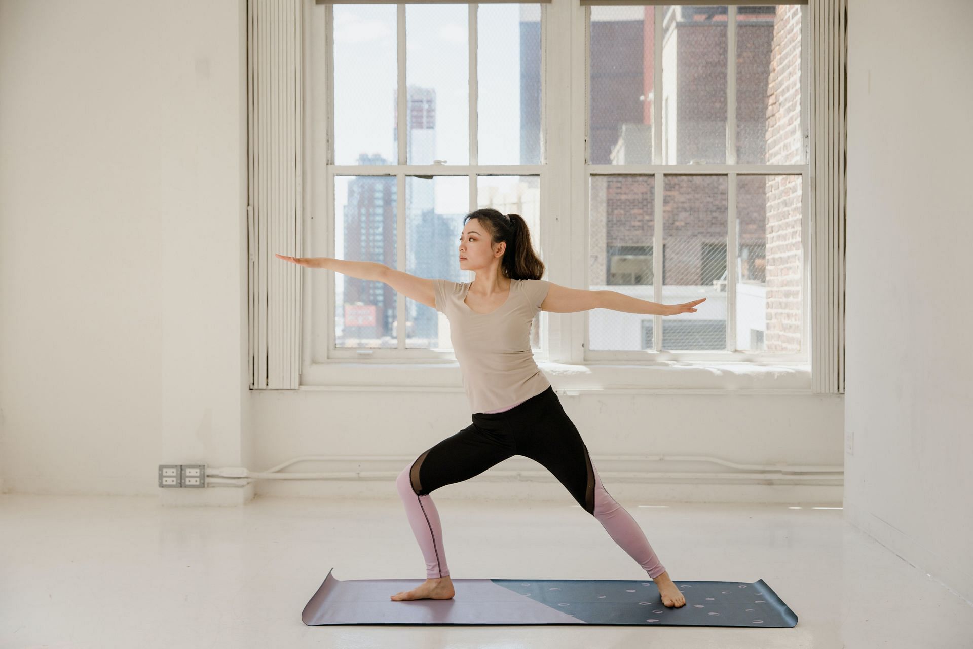 BIkram yoga is performed inside a room heated to 95-105 degrees. (Image via Pexels/Rodnae Productions)