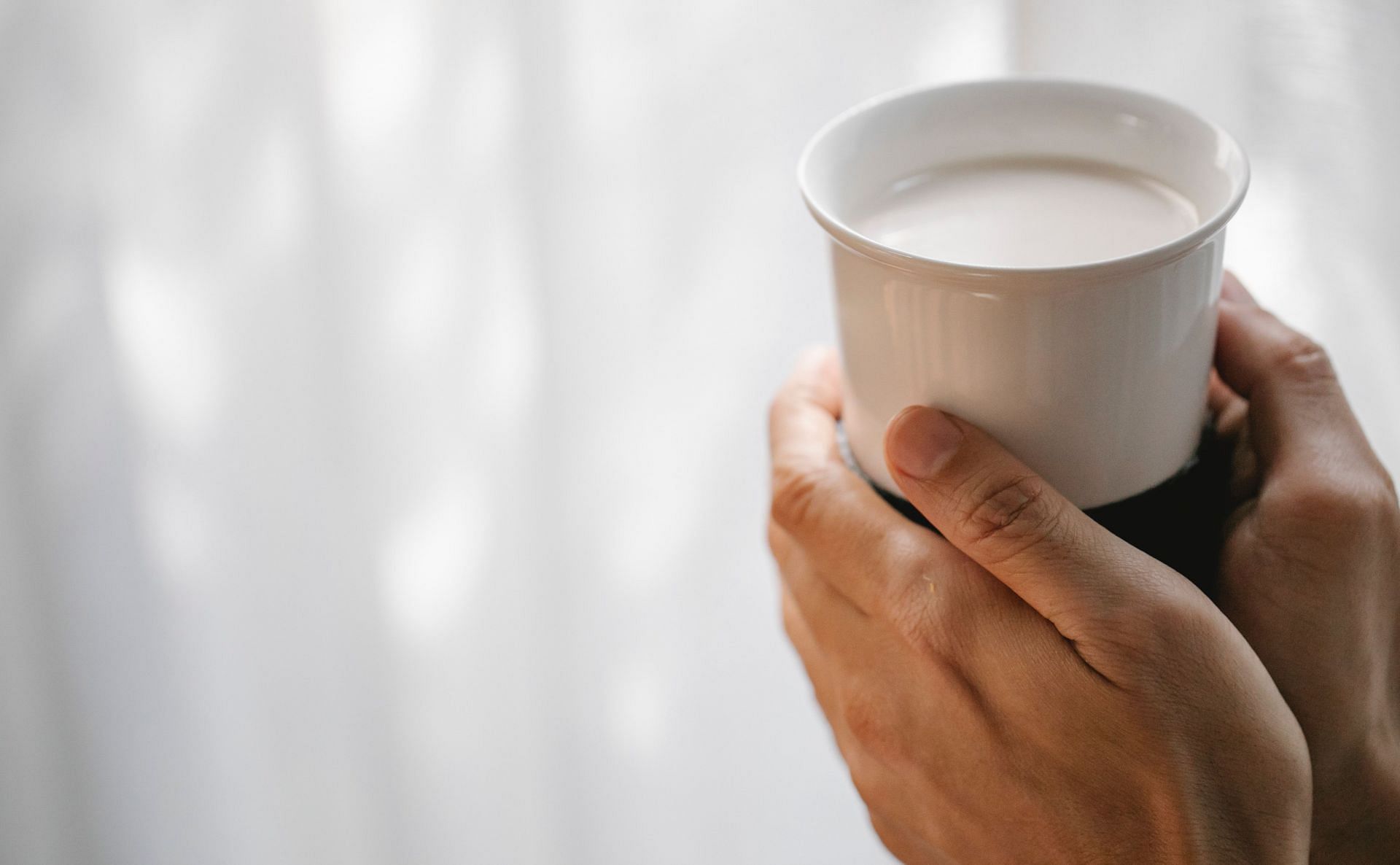 Warm milk is a great beverage to treat constipation (Image via Pexels @Charlotte May)