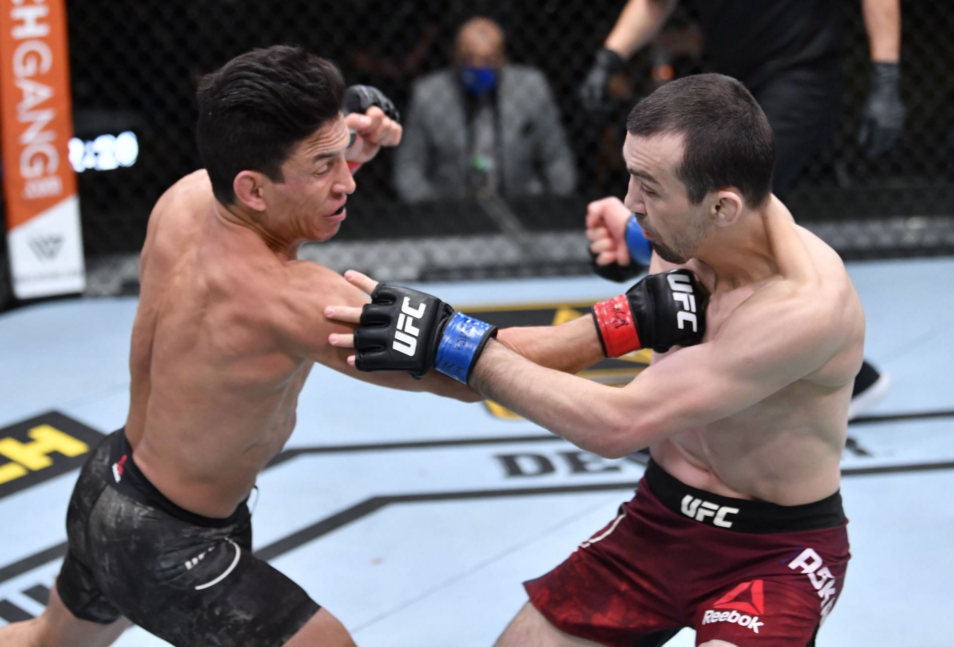 Joseph Benavidez (left) was violently finished by Demetrious Johnson in their rematch