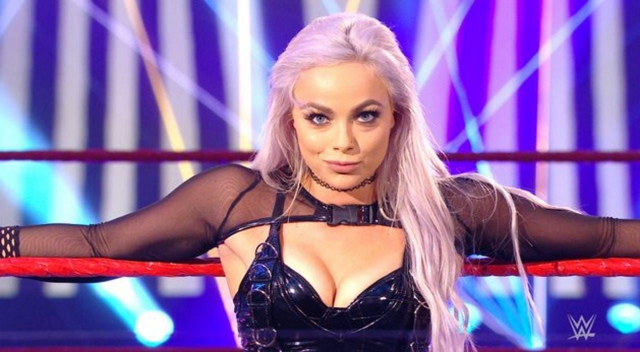 Liv Morgan breaks character as she poses with RAW Superstar and former WWE Champion