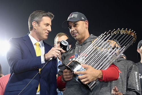 Manager Alex Cora is interviewed with the World Series trophy after his team's win over the Los Angeles Dodgers in Game Five to win the 2018 World Series