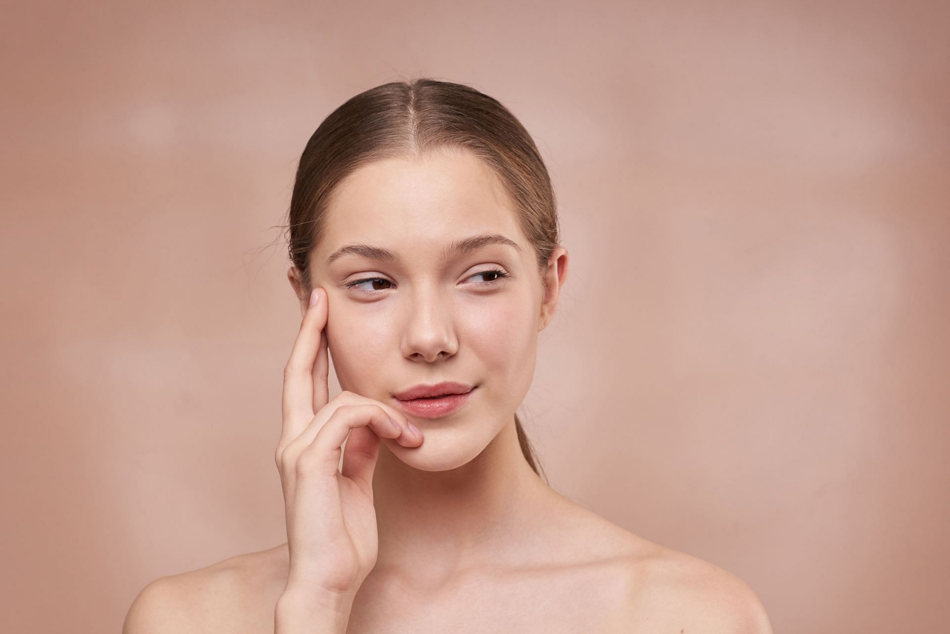 Woman with clear skin. (Image via Pexels/Shiny Diamond)