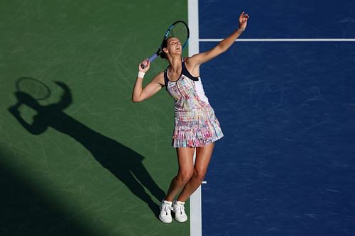 Karolina Pliskova serves during her first-round match at Dubai.