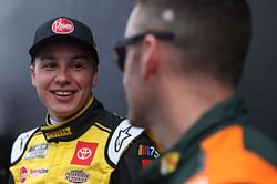 How did NASCAR award Christopher Bell the pole position despite rain washing out qualifying sessions in Fontana