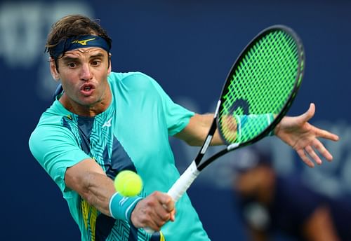 Malek Jaziri in action at the 2022 Dubai Tennis Championships.