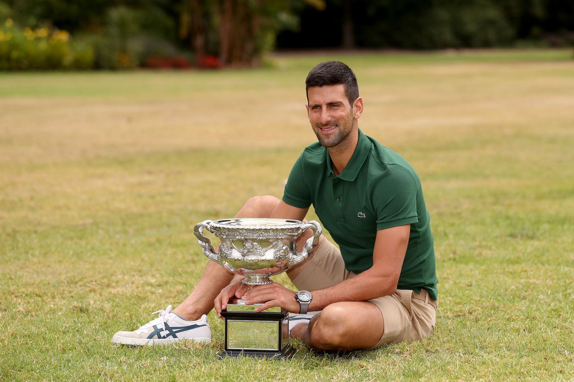 The Serbian superstar poses with his 2023 Australian Open trophy.