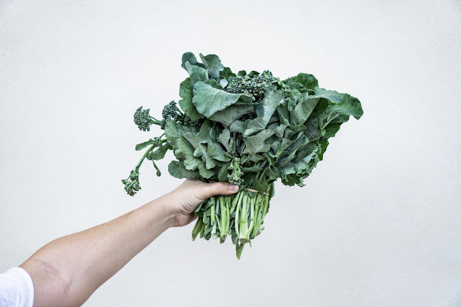 Consuming dark green leafy vegetables can improve your mood. (Photo via Pexels/Anna Guerrero)