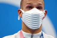 Gold medalist Caeleb Dressel of Team United States shows his emotion after receiving the gold medal for the Men's 100m Freestyle Final on day six of the Tokyo 2020 Olympic Games at Tokyo Aquatics Centre on July 29, 2021 in Tokyo, Japan. (Photo by Tom Pennington/Getty Images)