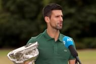 Novak Djokovic holds the 2023 Australian Open trophy.