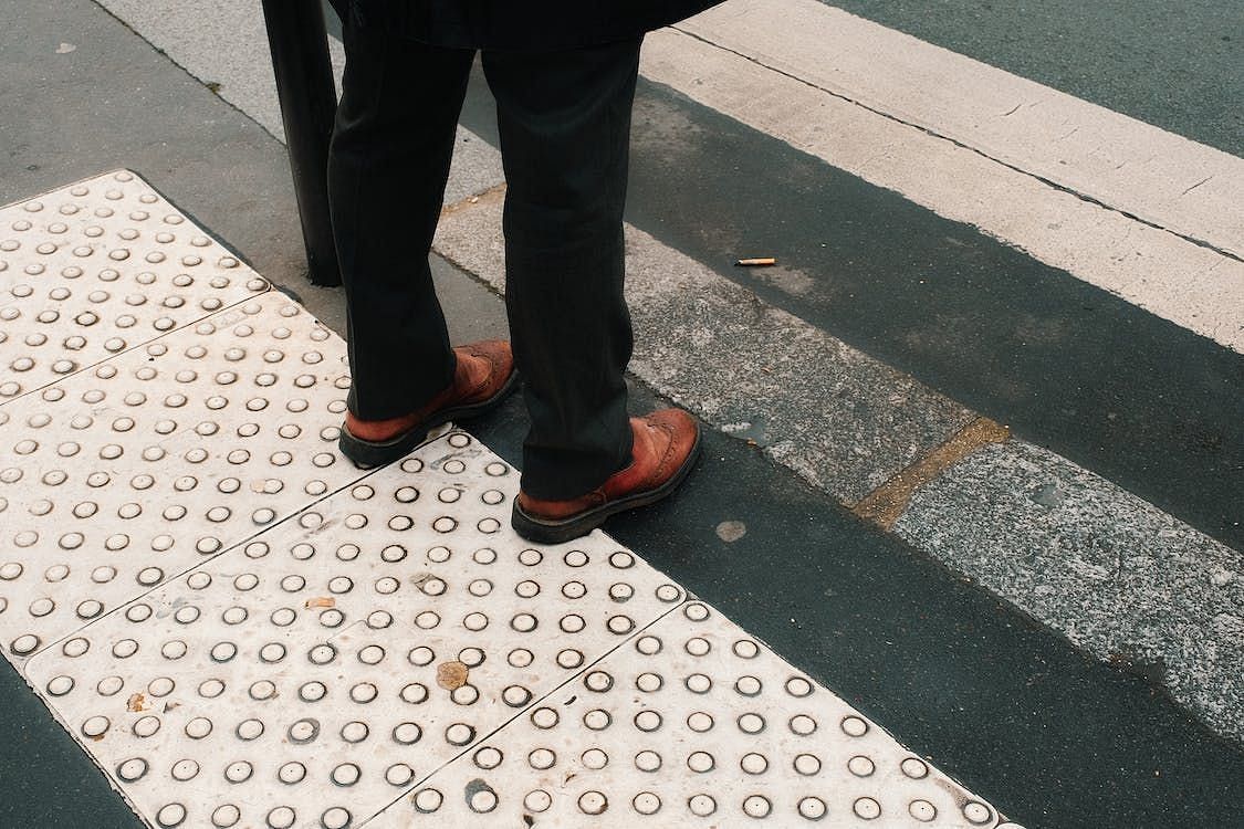 Standing for long can lead to cracked heels: Remedy for Cracked Heels (Image via Pexels/Mathias Reding)