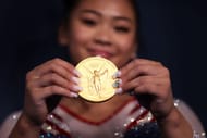 Sunisa Lee of Team United States poses with her gold medal after winning the Women's All-Around Final on day six of the Tokyo 2020 Olympics (Photo by Laurence Griffiths/Getty Images)