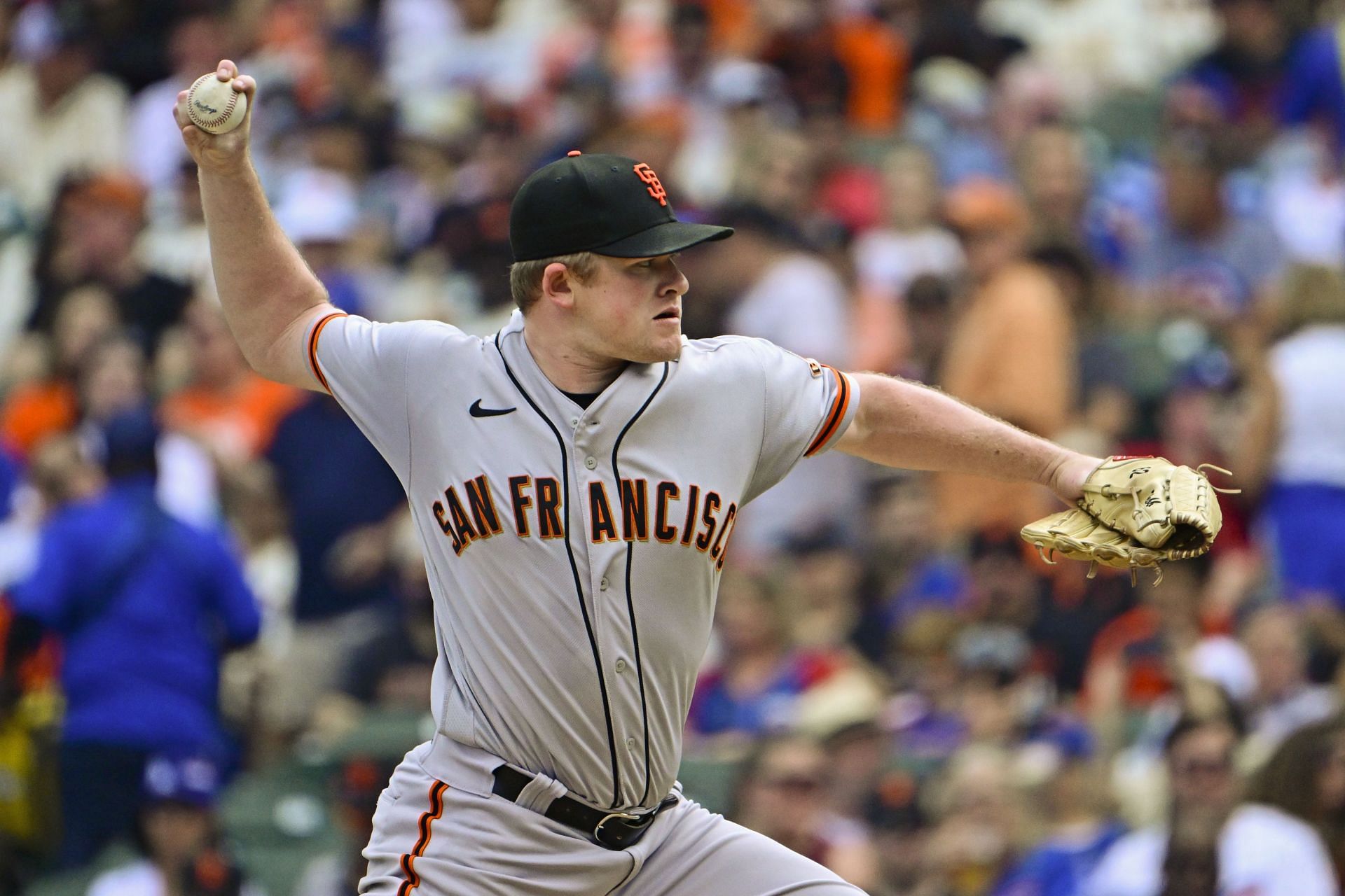 Starting pitcher Logan Webb of the San Francisco Giants delivers a pitch against the Chicago Cubs at Wrigley Field