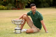 Novak Djokovic posing with the Australian Open trophy