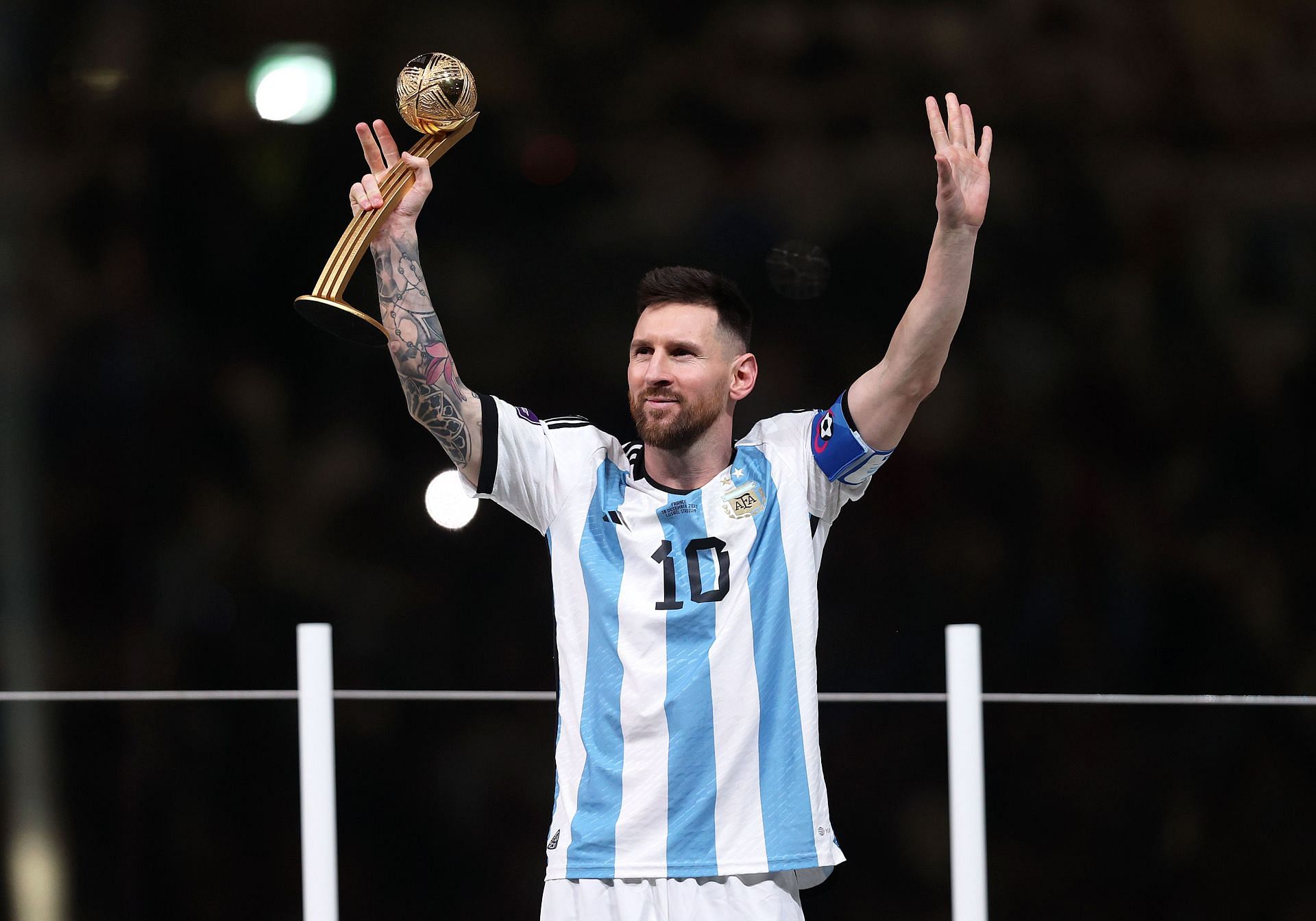 Lionel Messi with the Golden Ball Award at the 2022 FIFA World Cup in Qatar.