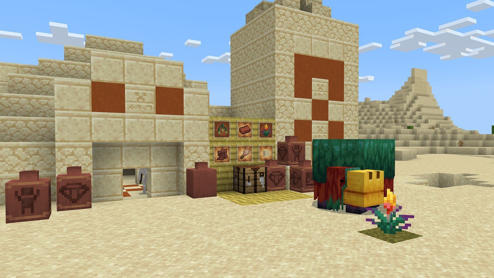 A sniffer relaxes near a Torchflower and archeology pottery in Minecraft&#039;s latest preview (Image via Mojang)