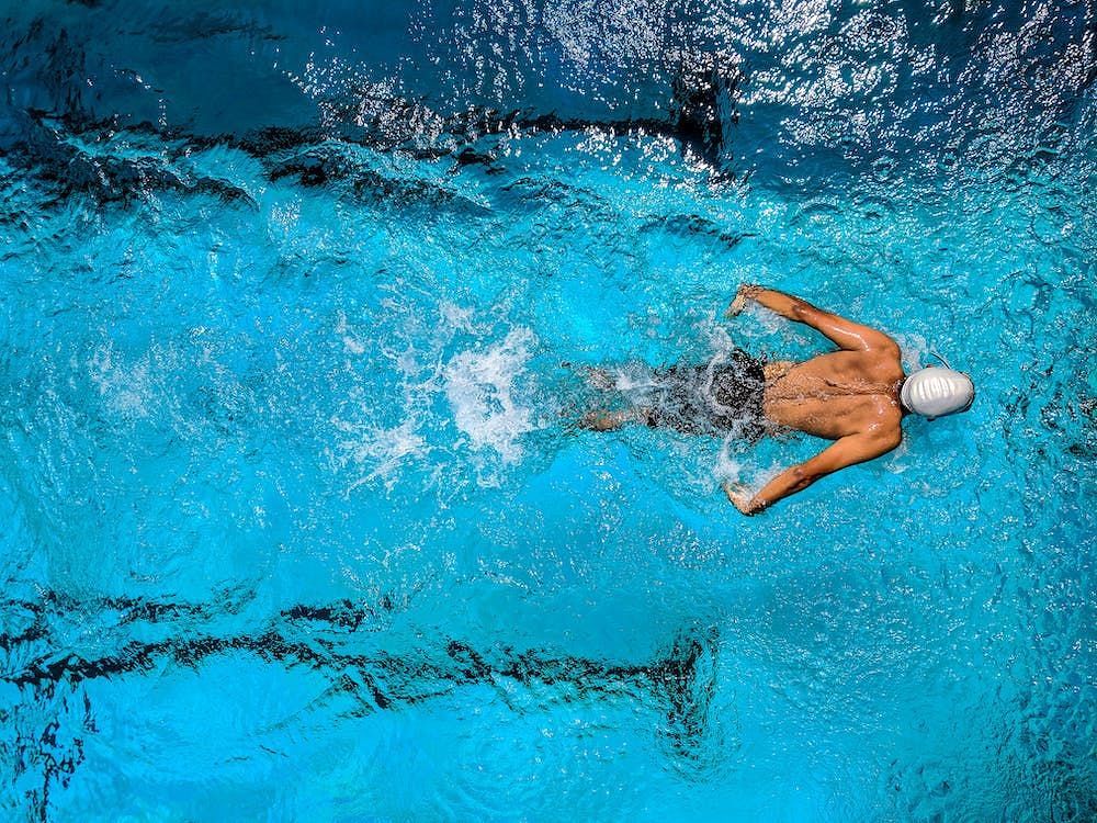 Swimming helps lower bad cholesterol. (Image via Pexels/Ajay Bhargav)