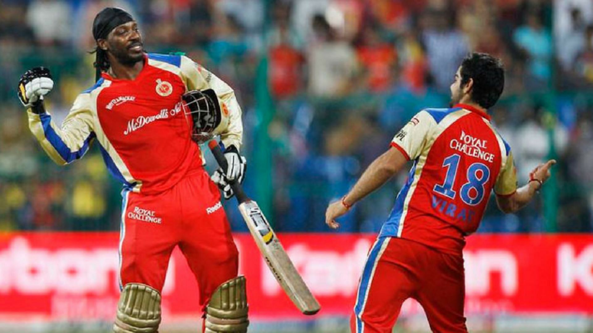 Chris Gayle (L) and Virat Kohli also had a healthy rivalry for the Orange Cap (P.C.:Twitter)