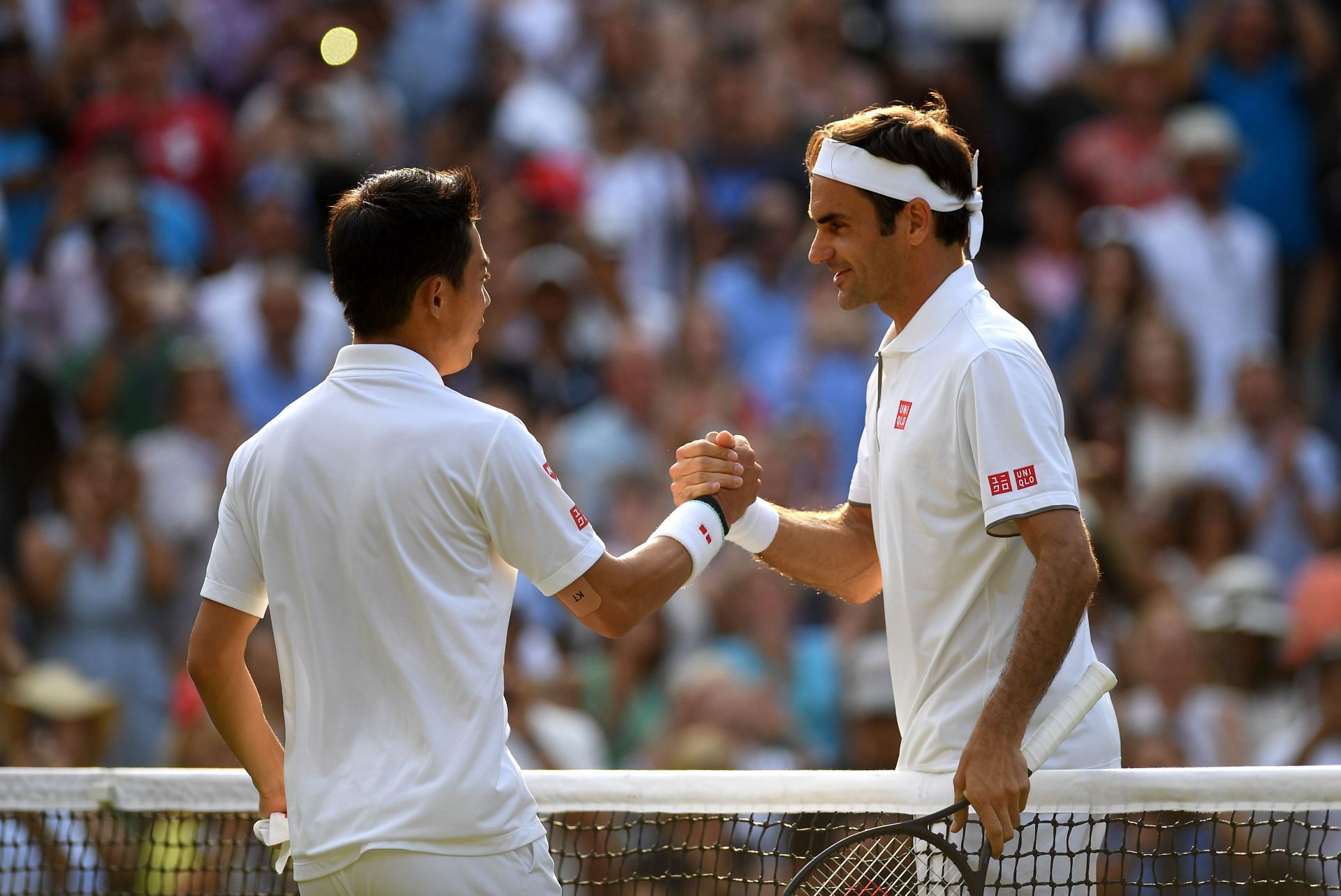 Kei Nishikori and Roger Federer at The Championships - Wimbledon 2019.