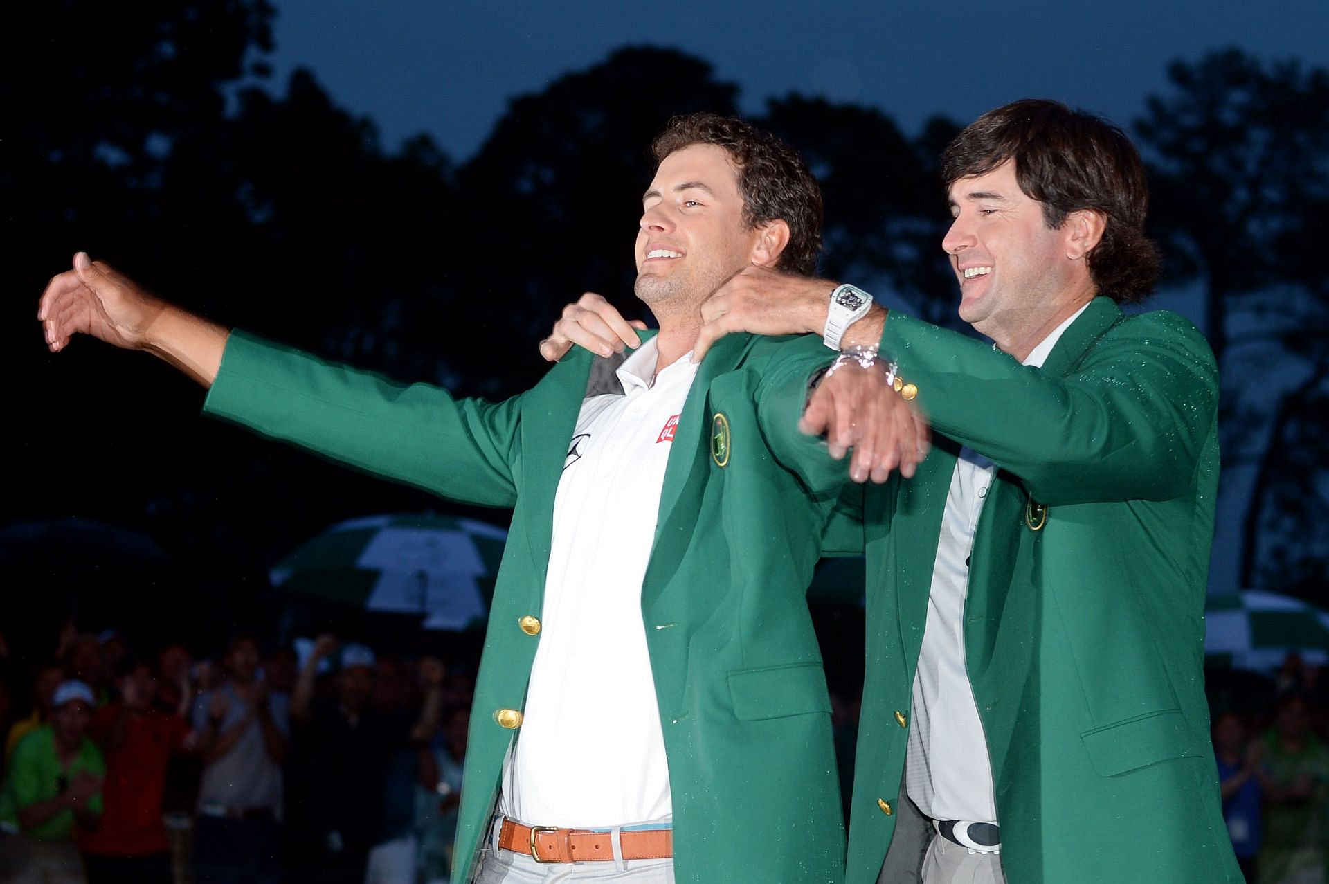 Adam Scott celebrates with Bubba Watson winning the 2013 Masters Tournament