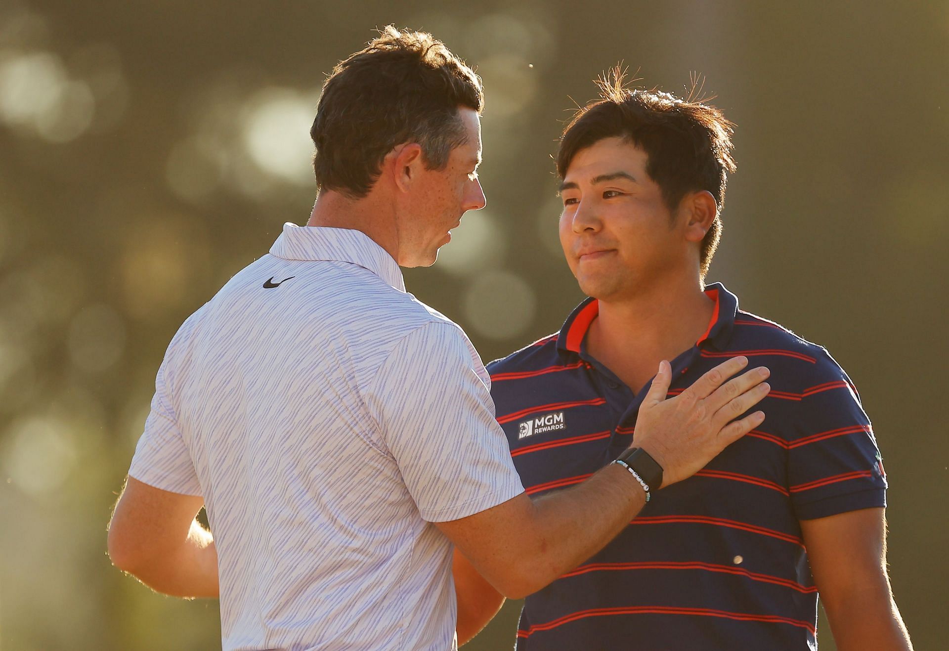 Rory McIlroy and Kurt Kitayama during last year