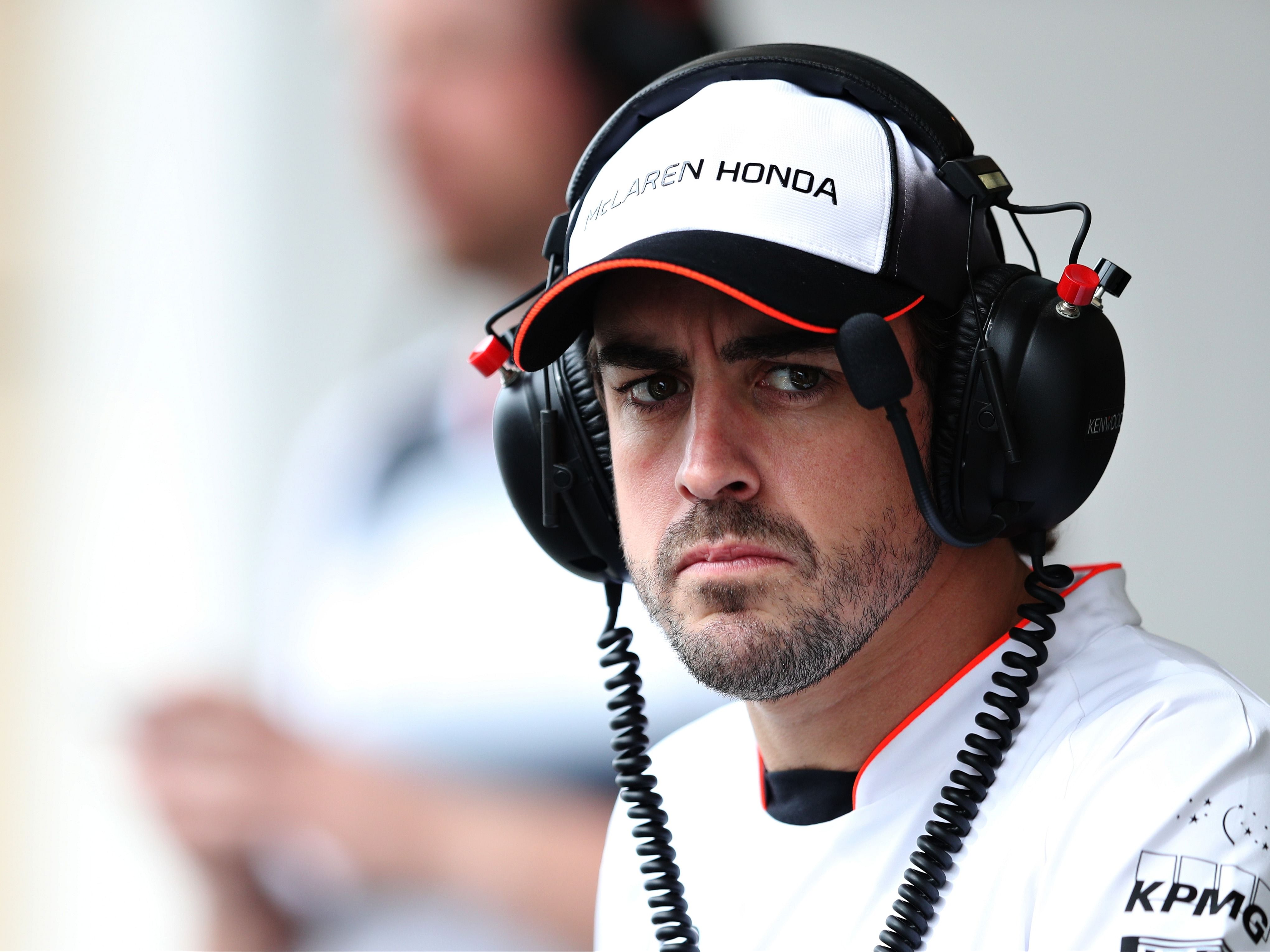 Fernando Alonso watches the action in the pitlane during practice for the 2016 F1 Bahrain Grand Prix. (Photo by Mark Thompson/Getty Images)