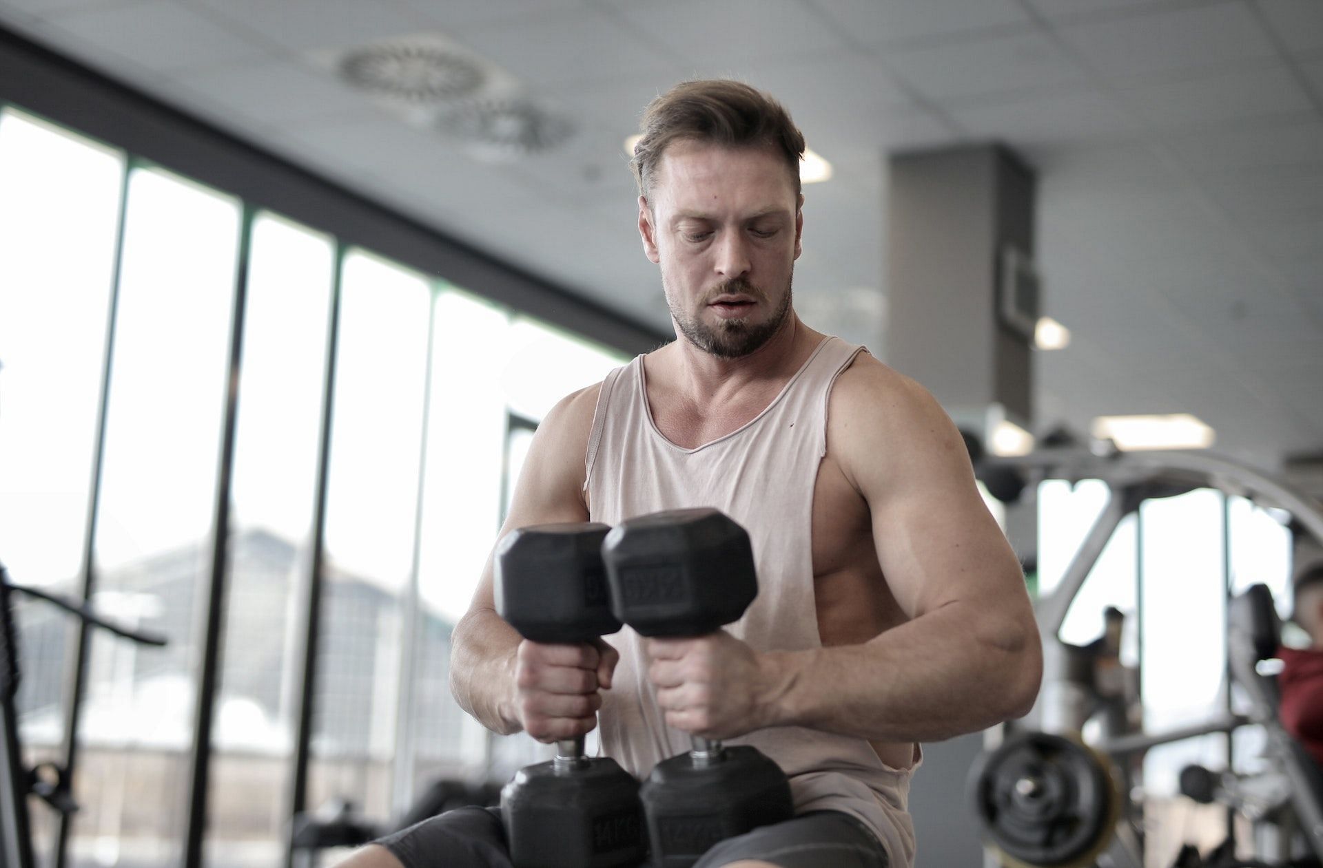 Dumbbell shoulder press is an excellent shoulder strengthening exercise. (Photo via Pexels/Andrea Piacquadio)