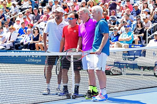 McEnroe (fourth from left) and Michael Chang (second from left) during an exhibition match