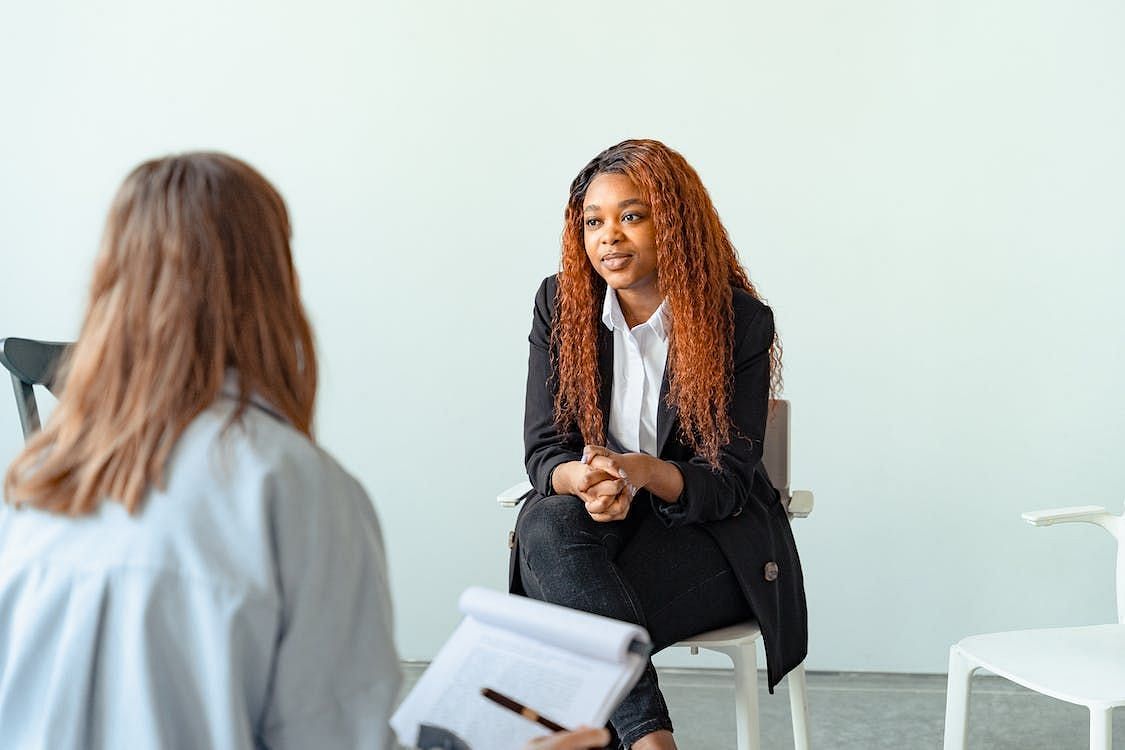 Support groups and psychotherapy can help (Image via Pexels/Antoni Shkraba)