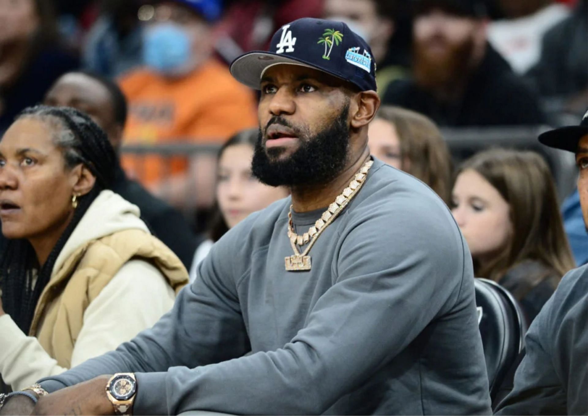 LeBron James was trolled by a fan as he entered the gym to watch his son, Bronny James play. [photo: Essentially Sports]
