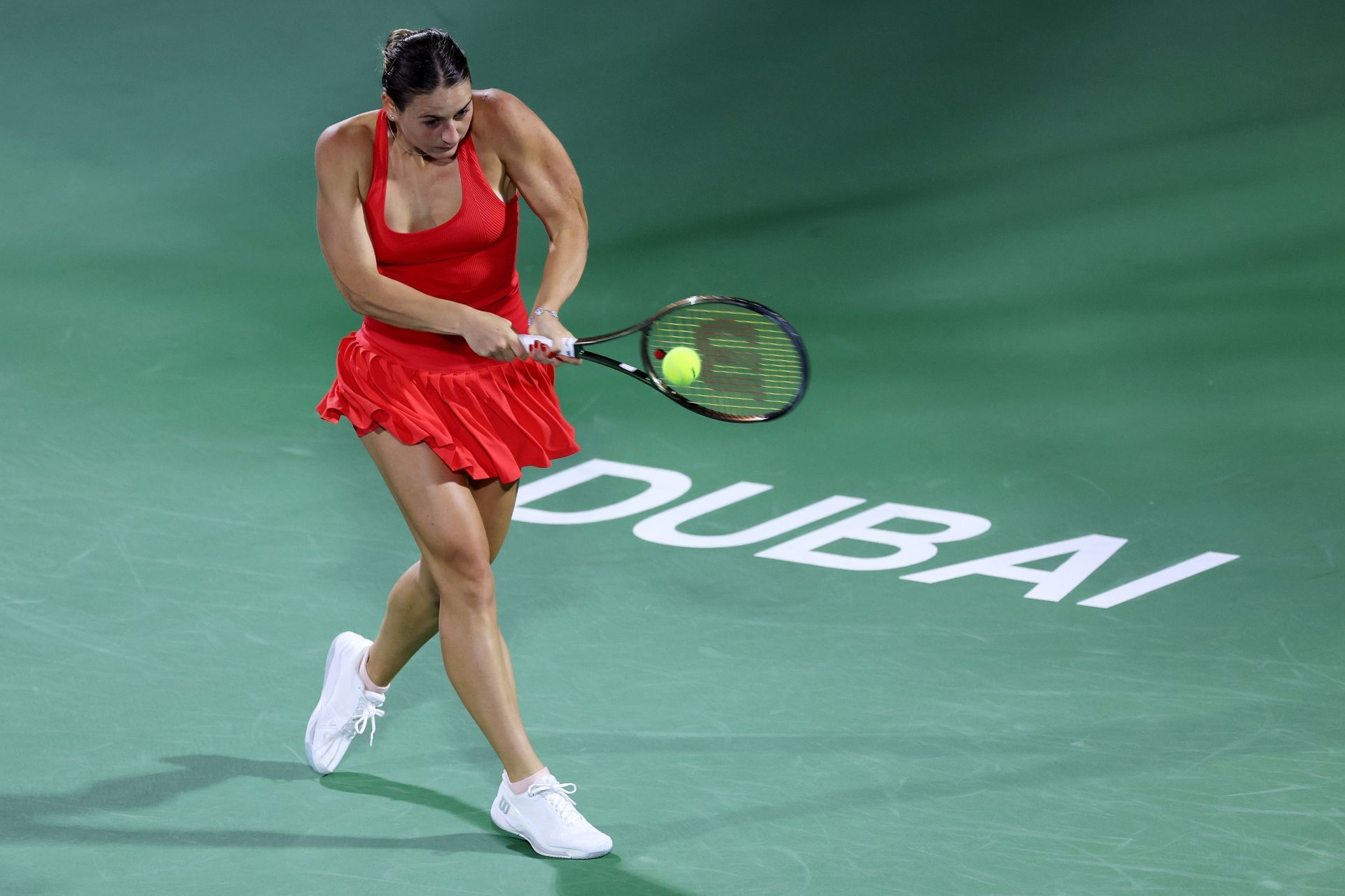 Marta Kostyuk in action at the Dubai Tennis Championships