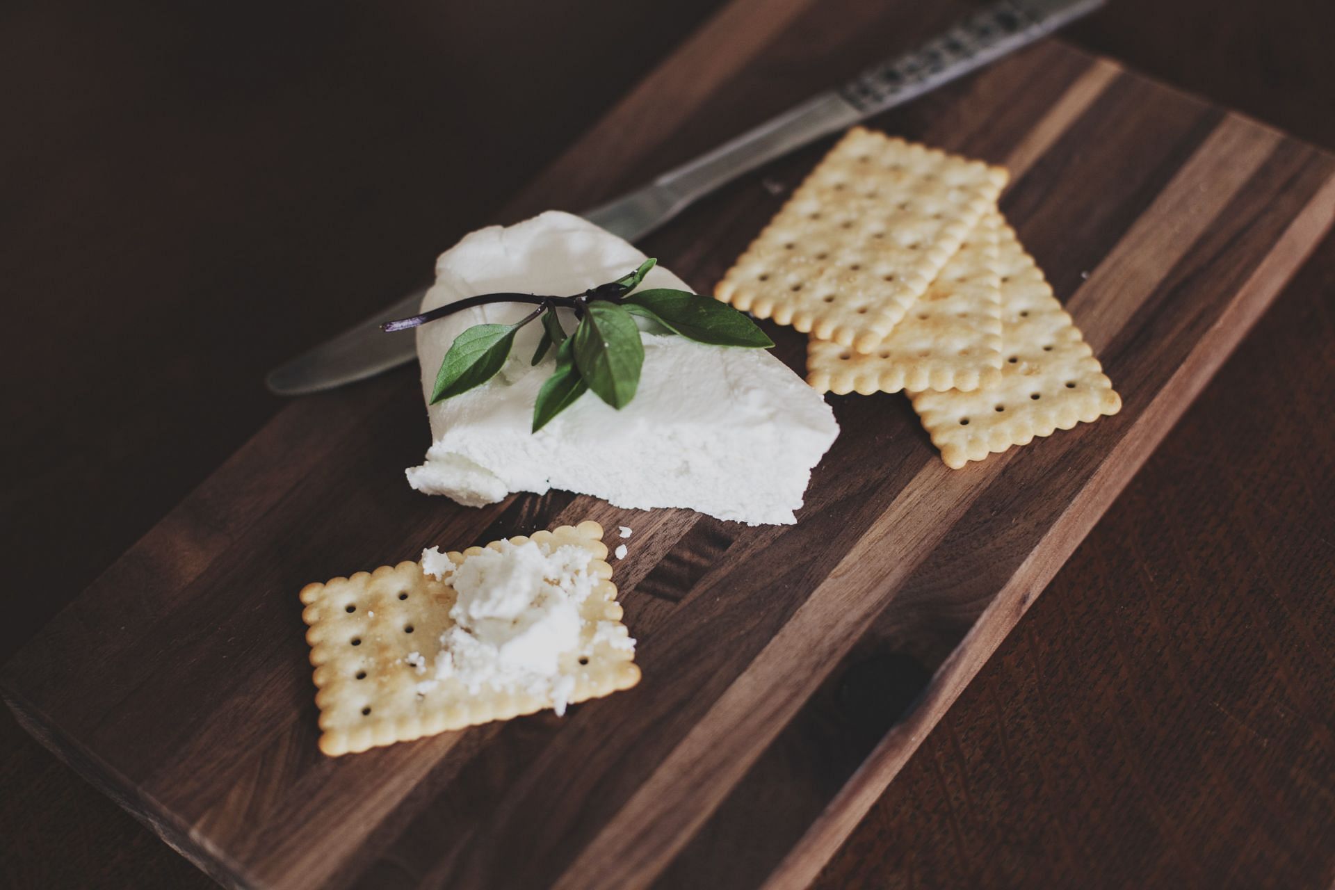 Cream cheese with crackers is a popular delicacy. (Image via Unsplash/Anita Peeples)