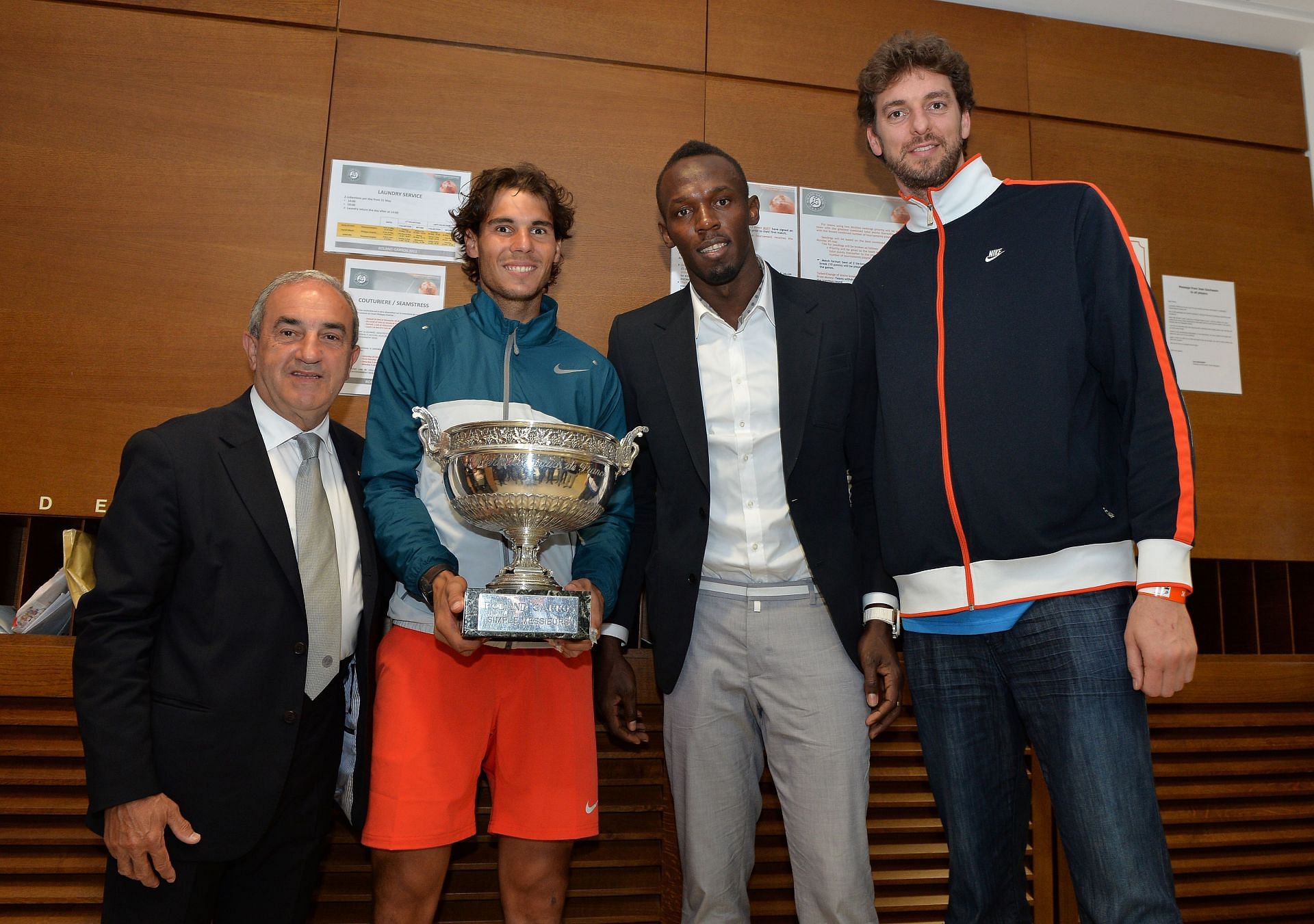 Pau Gasol (R) and Usain Bolt celebrate with Rafael Nadal at the 2013 French Open.
