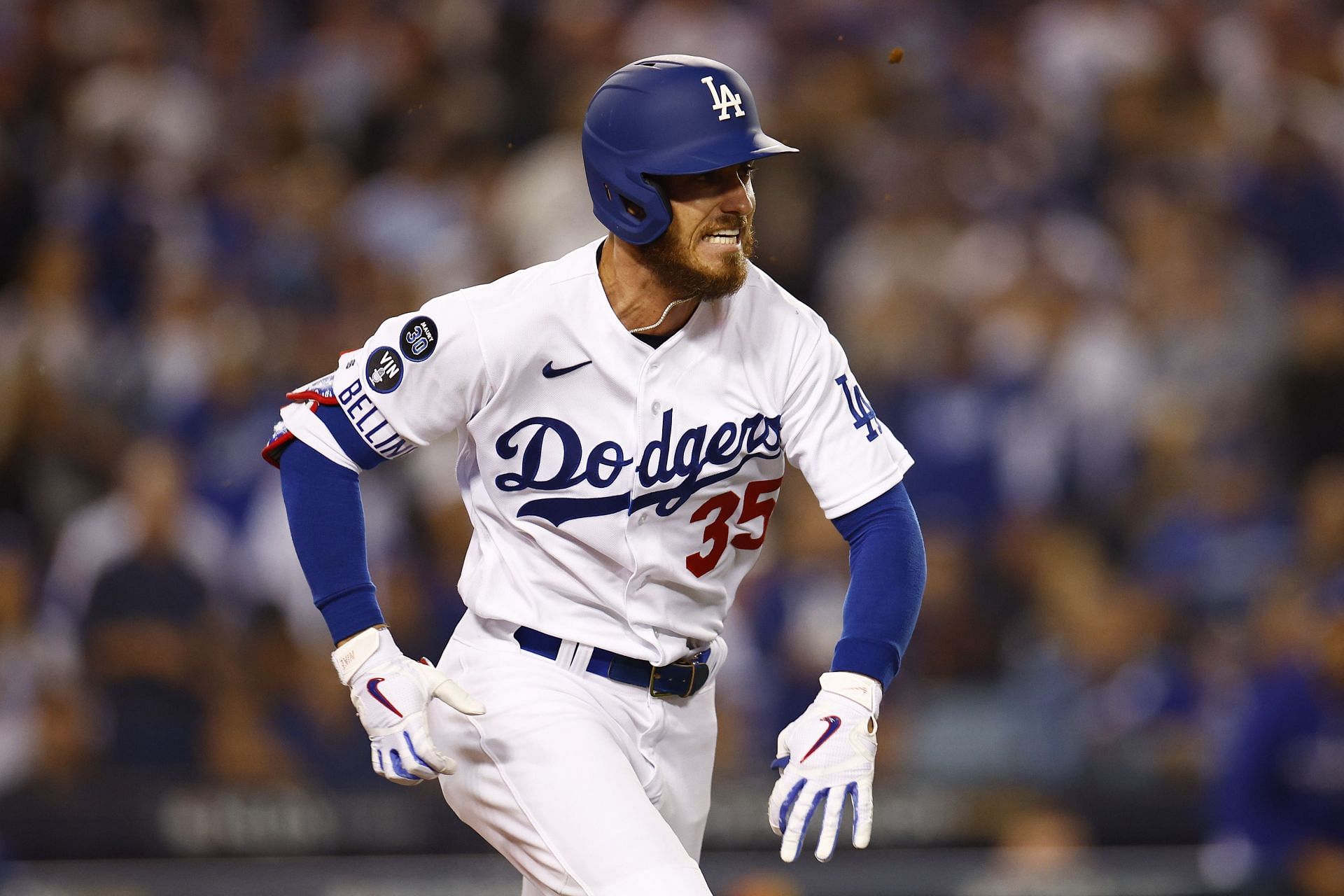 Cody Bellinger reaches first base in game one of the National League Division Series at Dodger Stadium