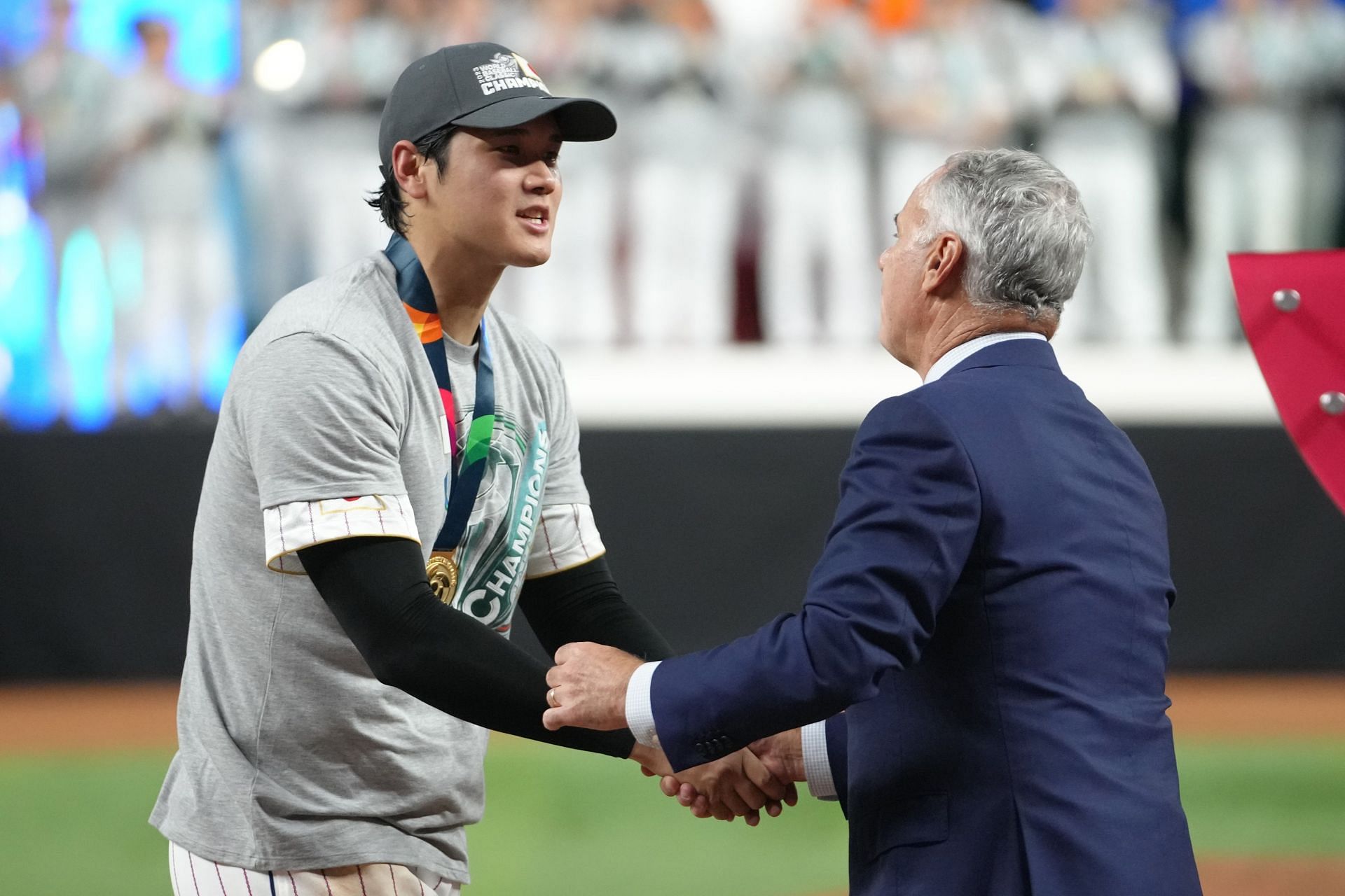 Shohei Ohtani is presented the medal after defeating Team USA during the WBC Championship at loanDepot park