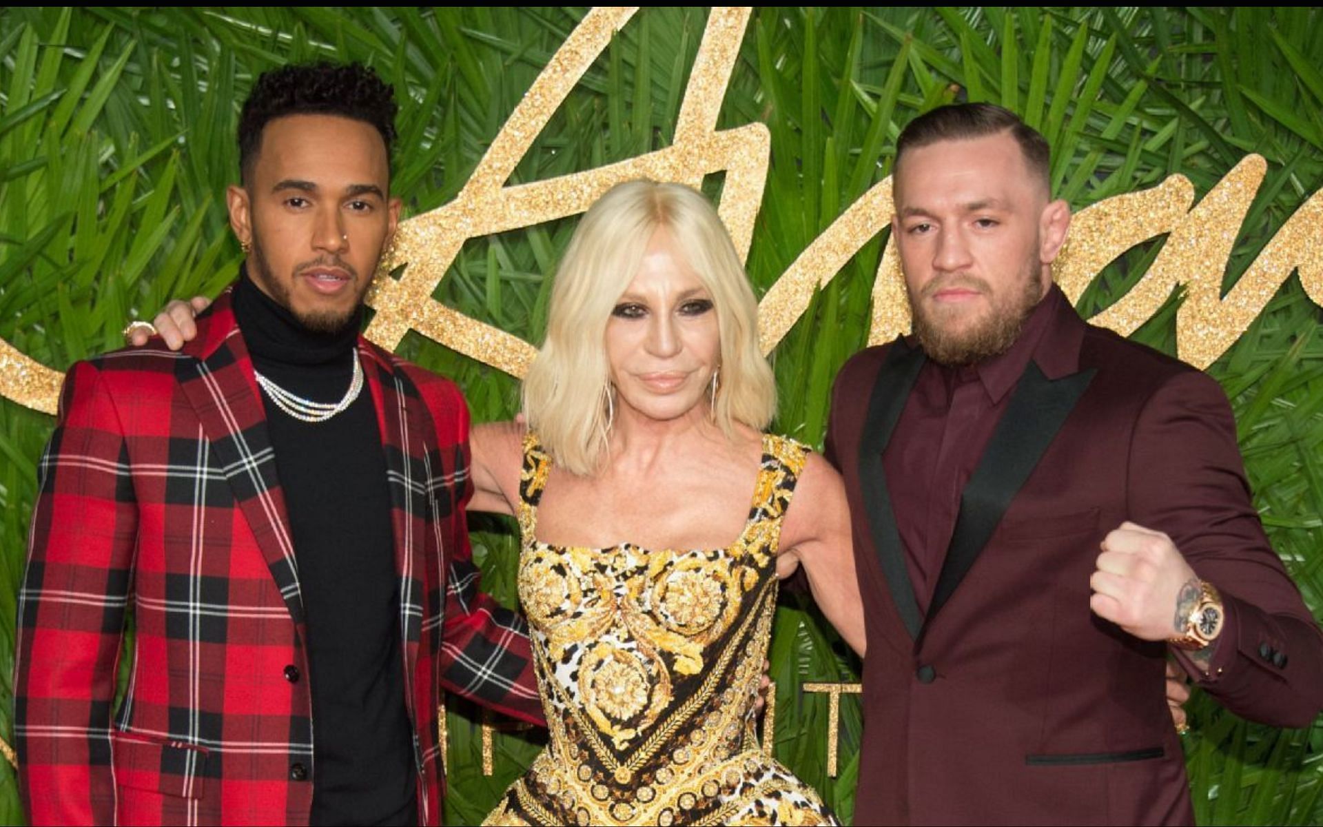 Lewis Hamilton [Left] Donatella Versace [Center] Conor McGregor [Right] at the British Fashion Awards 2017 [Image courtesy: www.espn.com]