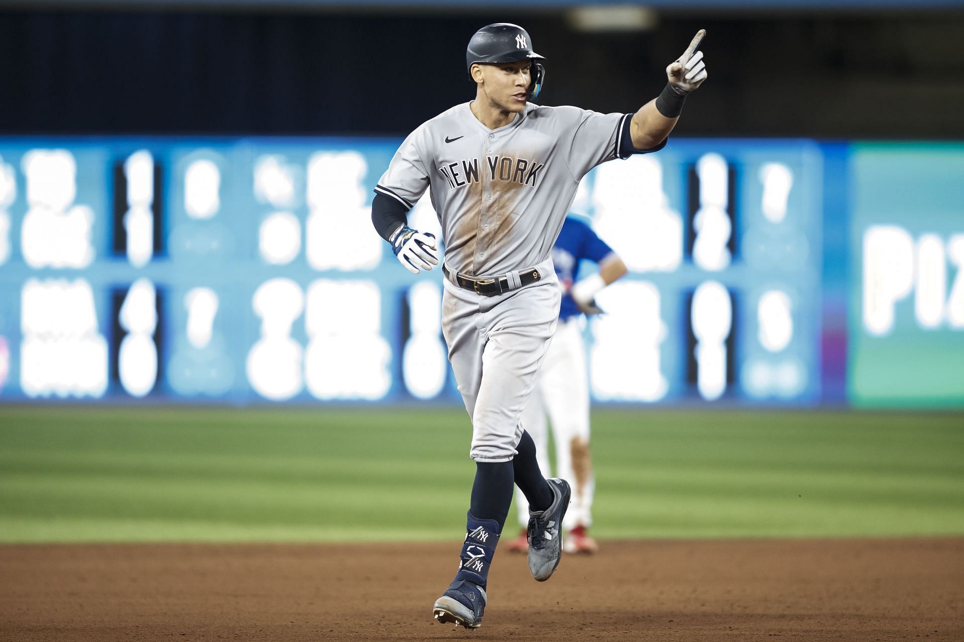 Judge #99 of the New York Yankees runs the bases as he hits his 61st home run of the season in the seventh inning against the Toronto Blue Jays at Rogers Centre on September 28, 2022 in Toronto, Ontario, Canada.