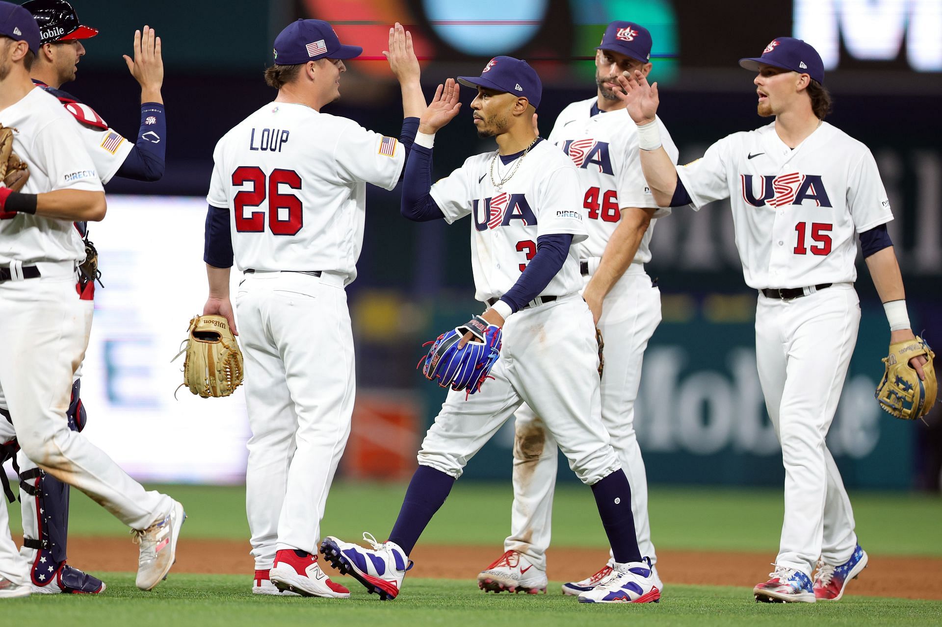 Mookie Betts #3 of Team USA and Aaron Loup #26 celebrate after defeating Team Cuba 14-2 during the World Baseball Classic Semifinals