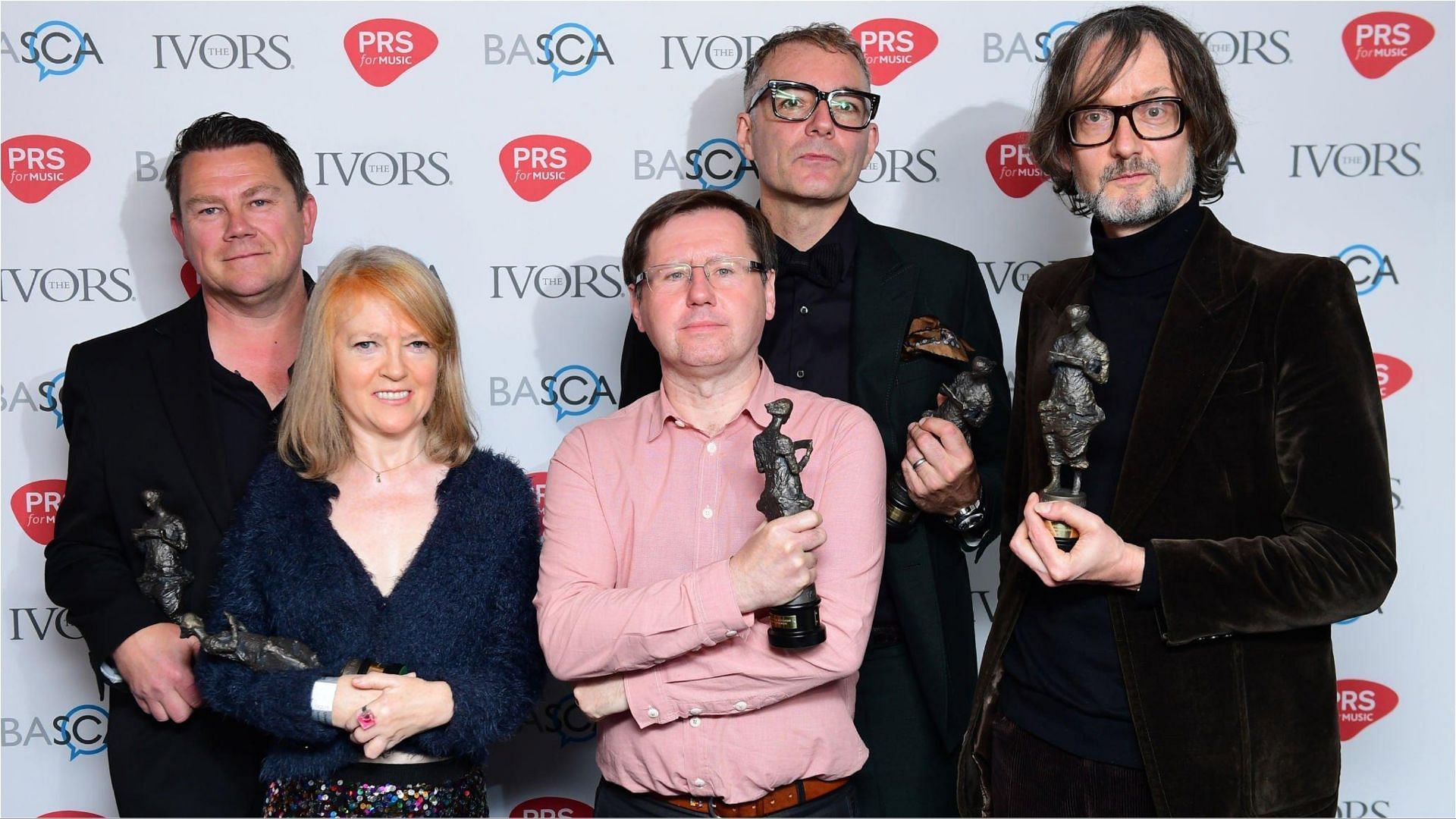 Steve Mackey with the rest of the band members (Image via Ian West/Getty Images)