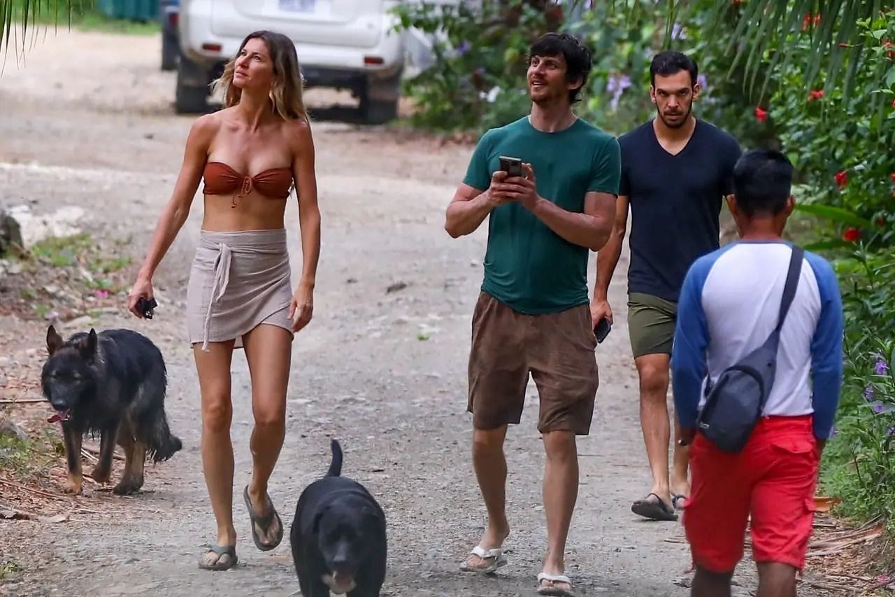 Gisele Bundchen alongside Joaquim Valente (blue), out for a stroll in Costa Rica (Photo credit - Backgrid)