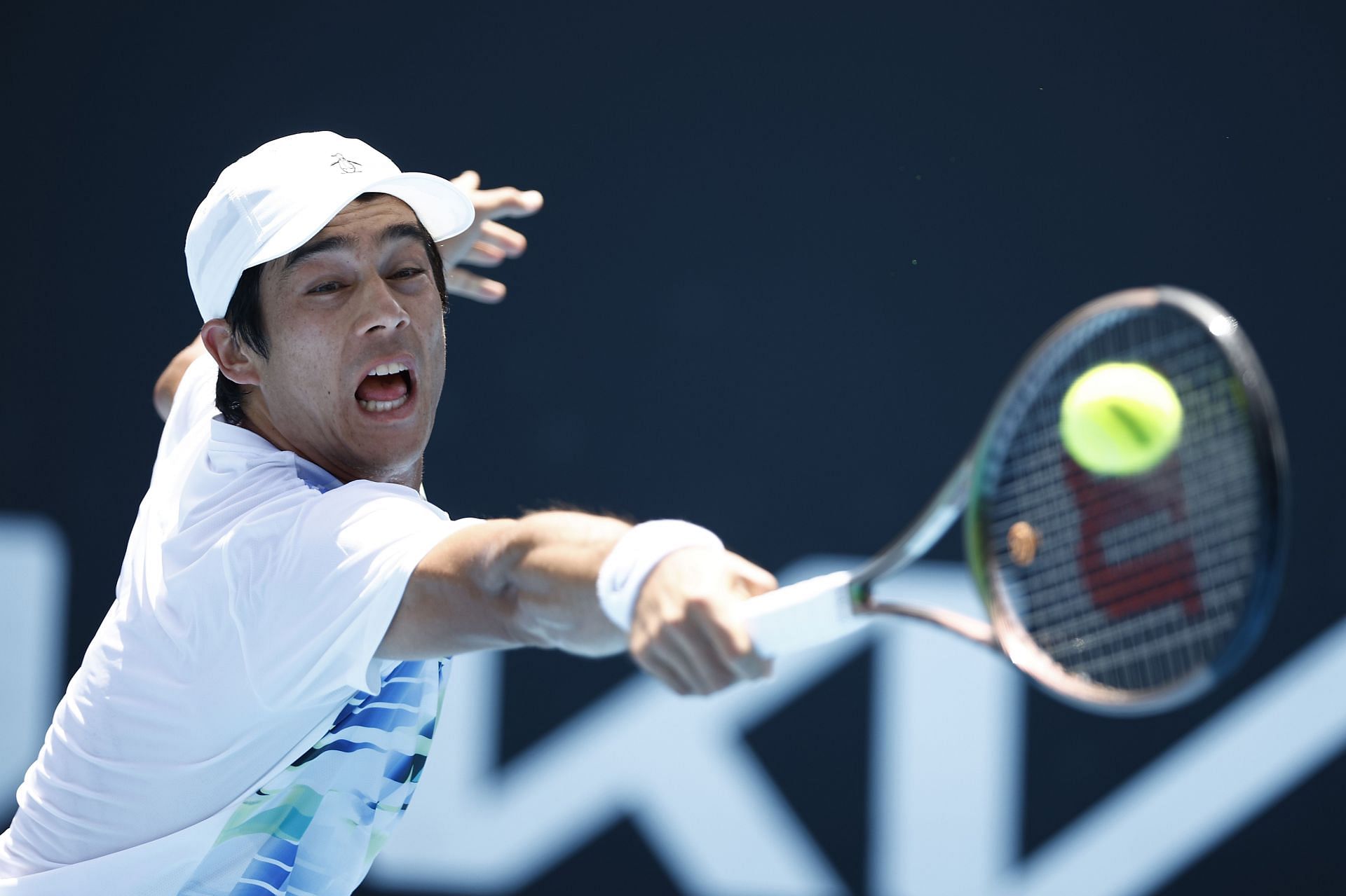 Nakashima tries to reach the ball at the 2023 Australian Open